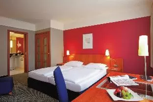 Photo of the whole room, Bed in Vienna House by Wyndham Sonne Rostock