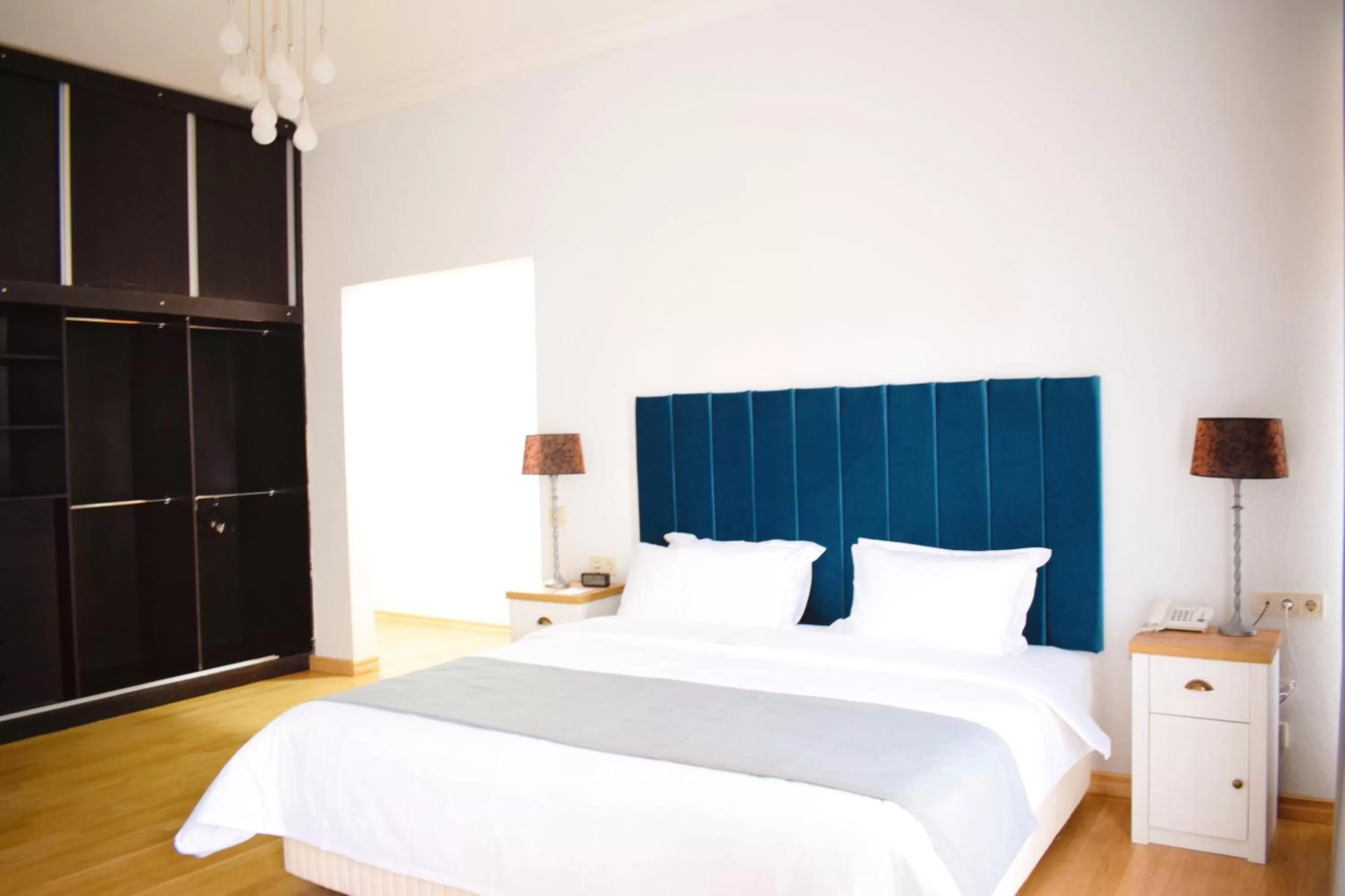 Bed in Octava Boutique Hotel