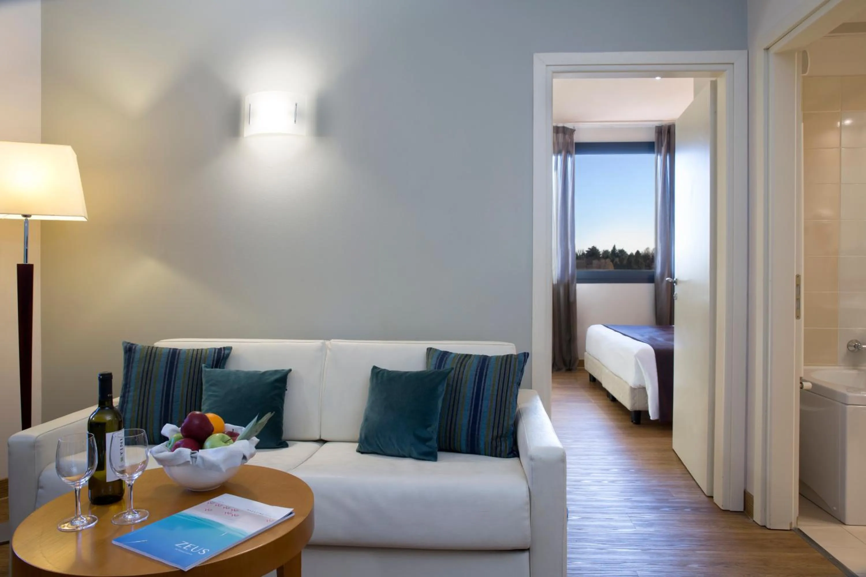 Seating area, Bed in Zeus Essence Dolce by Wyndham Milan Malpensa