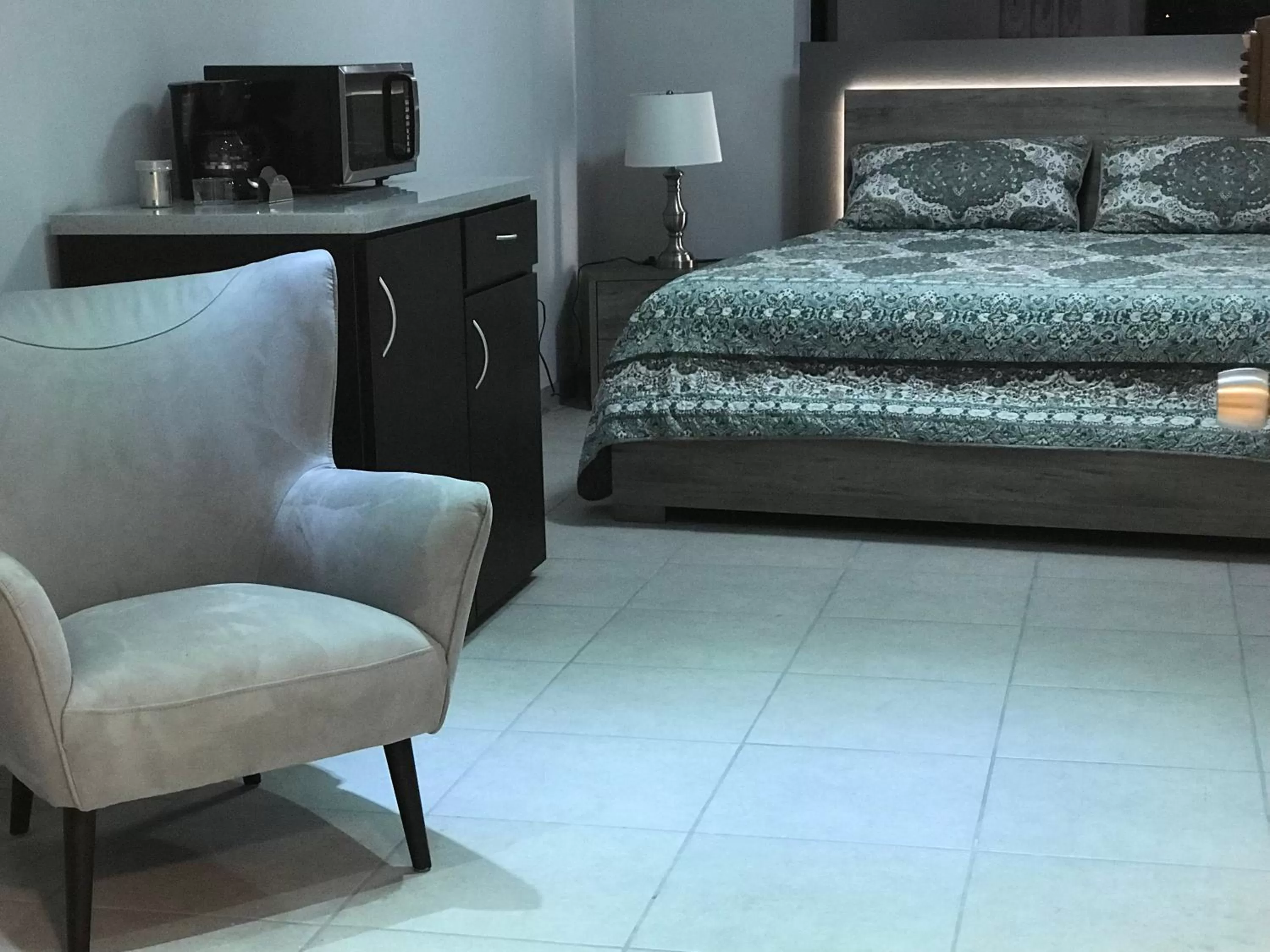 Seating area, Bed in Itza-Bella Suites