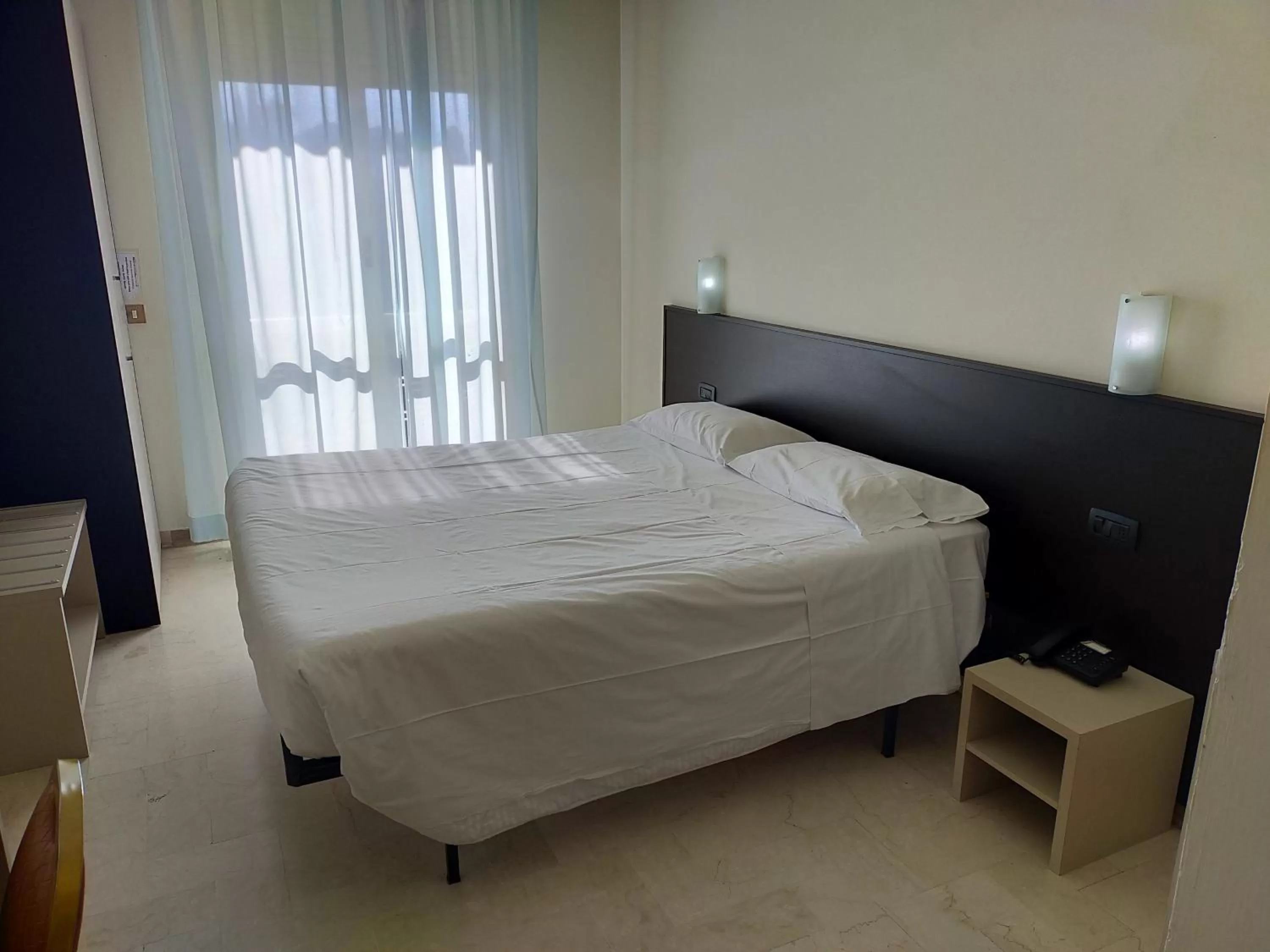 Bed in AUTO PARK Hotel