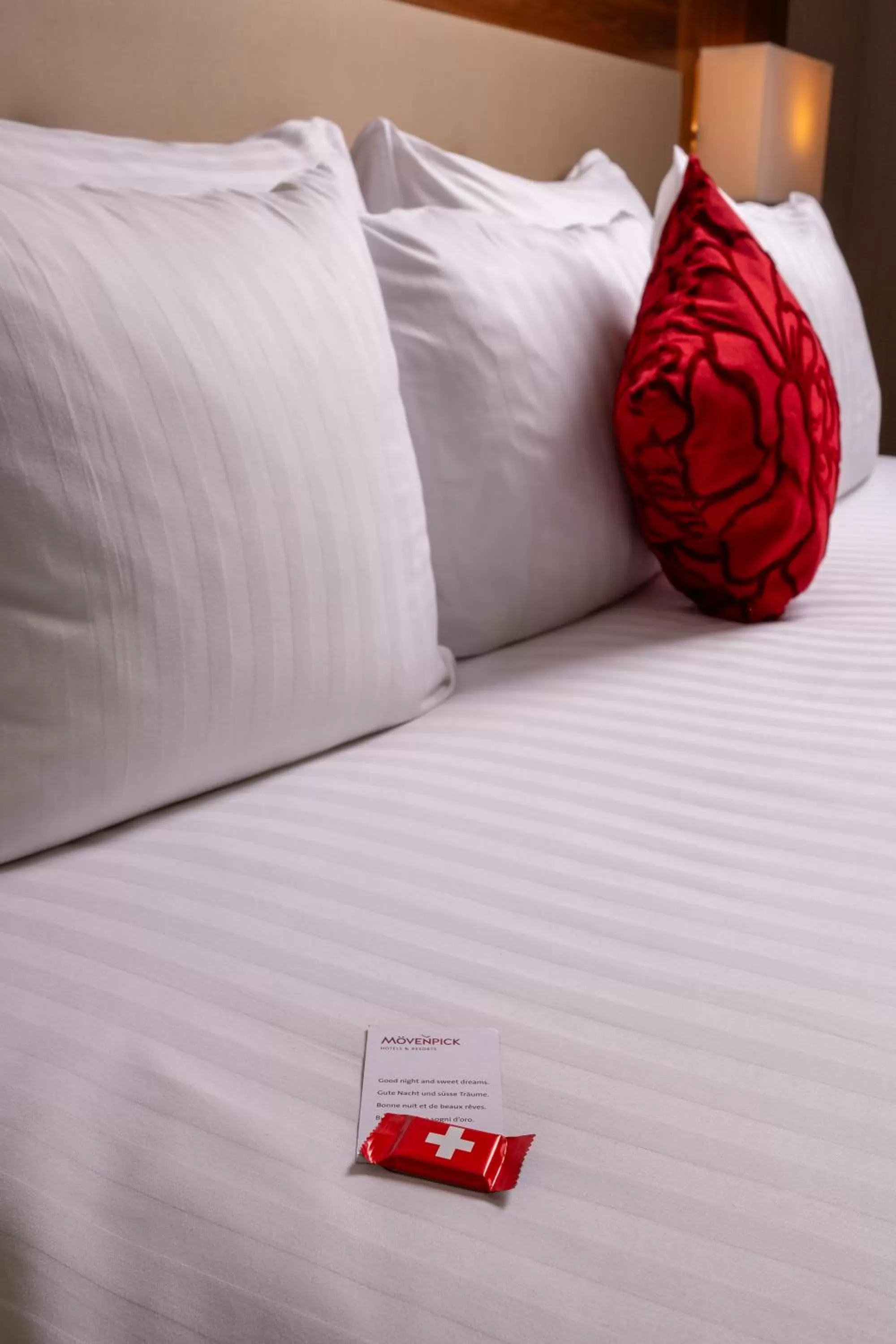 Bed in Mövenpick Hotel Geneva