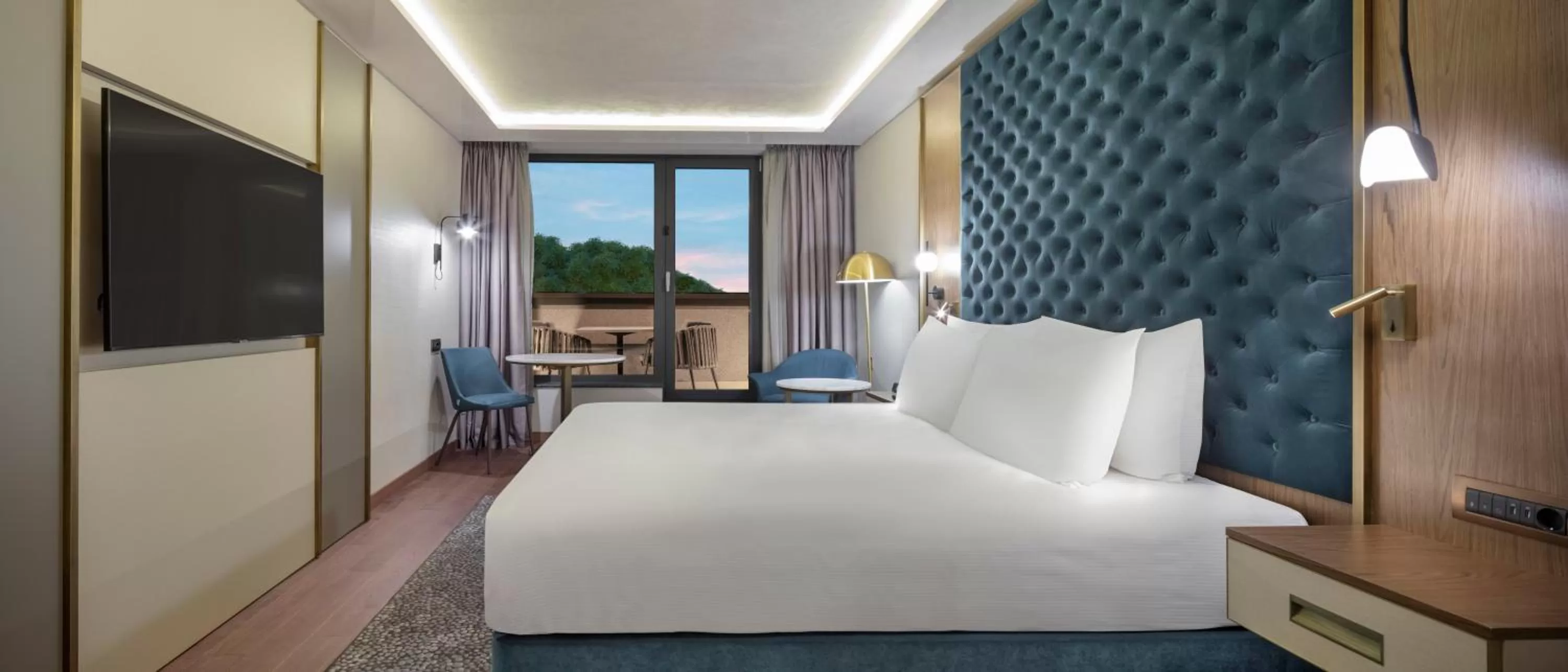 Communal lounge/ TV room, Bed in Doubletree By Hilton Plovdiv Center