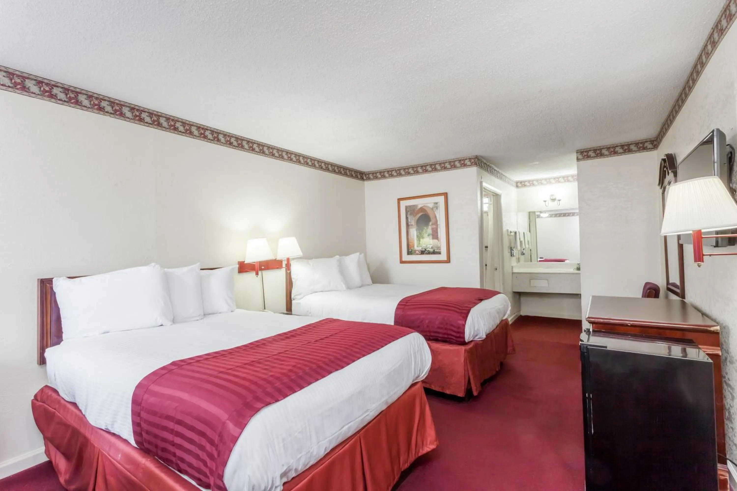 Bed in Knights Inn Hurricane Mills