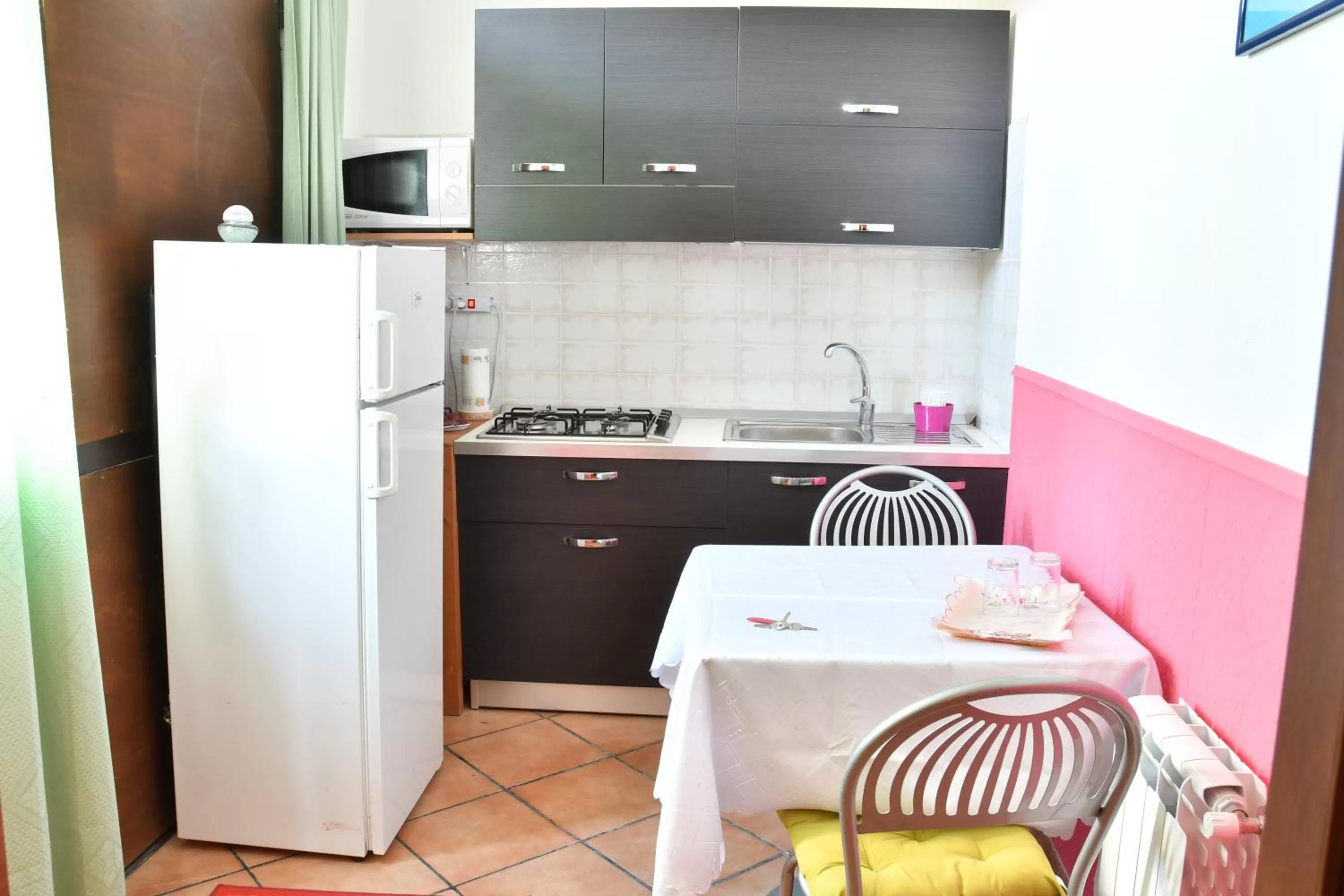 Kitchen/Kitchenette in B&B Mitzixeddas Sa Domu de Braxia