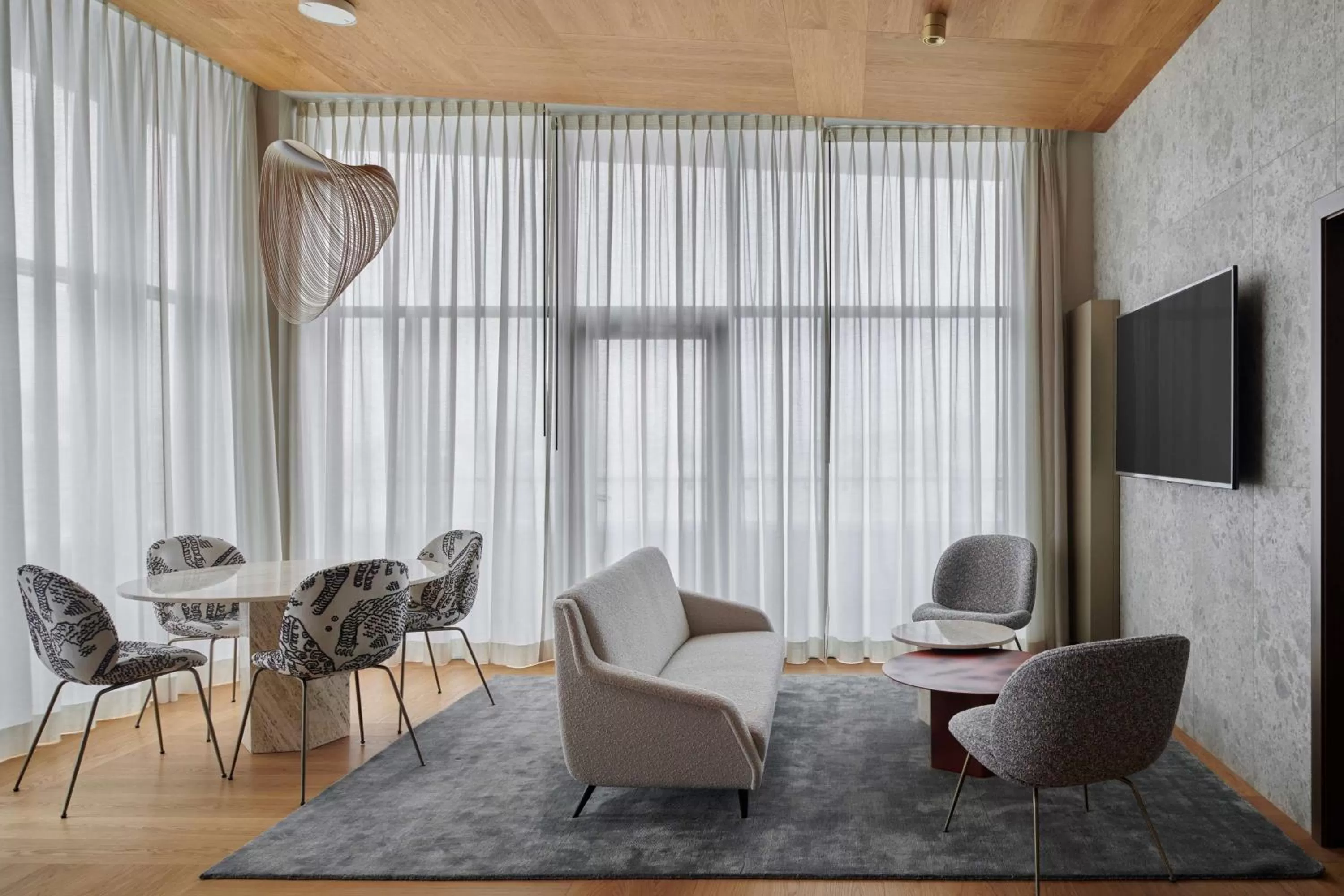 Living room in Iceland Parliament Hotel, Curio Collection By Hilton
