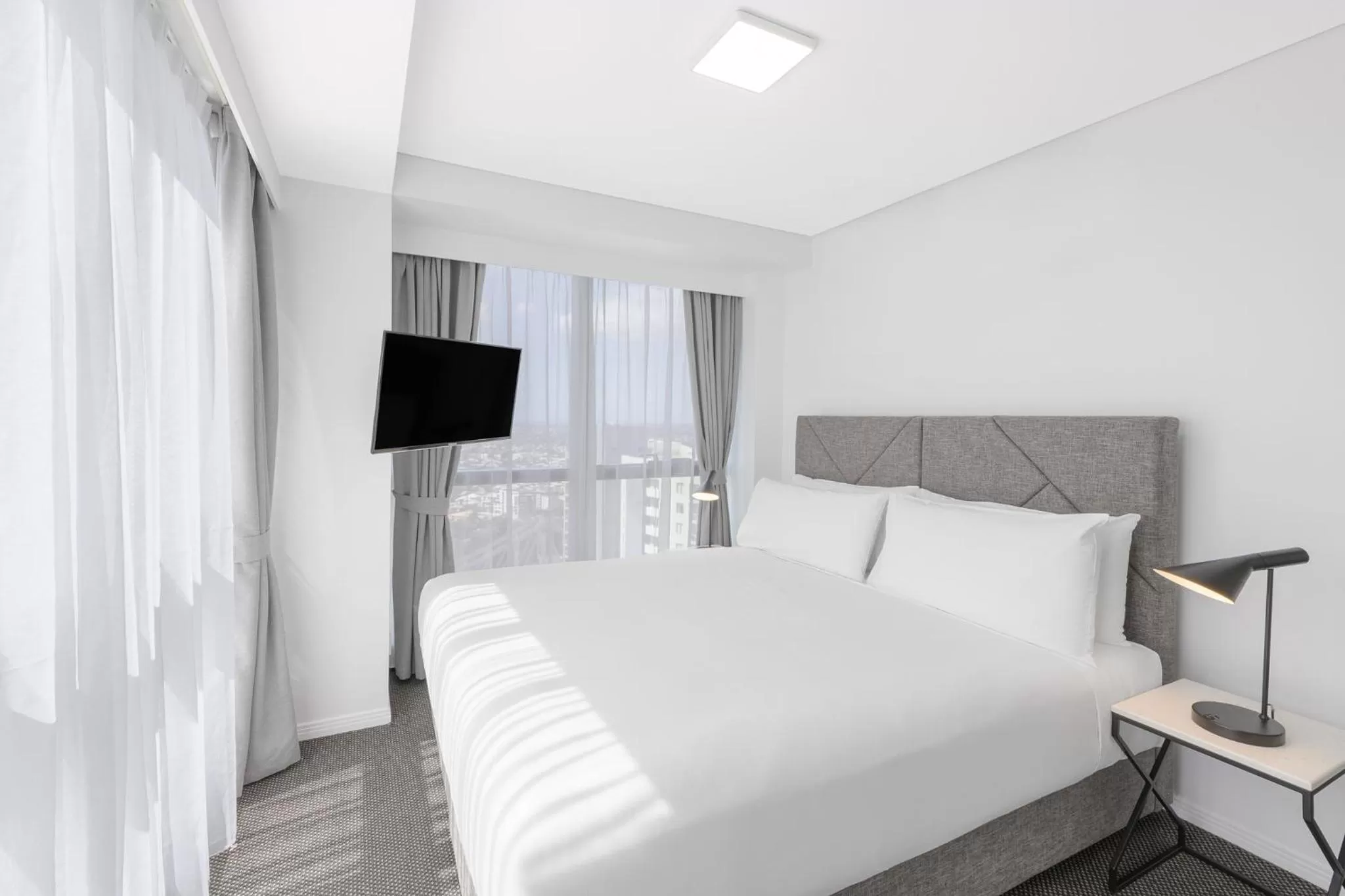 Bed in Meriton Suites Adelaide Street, Brisbane