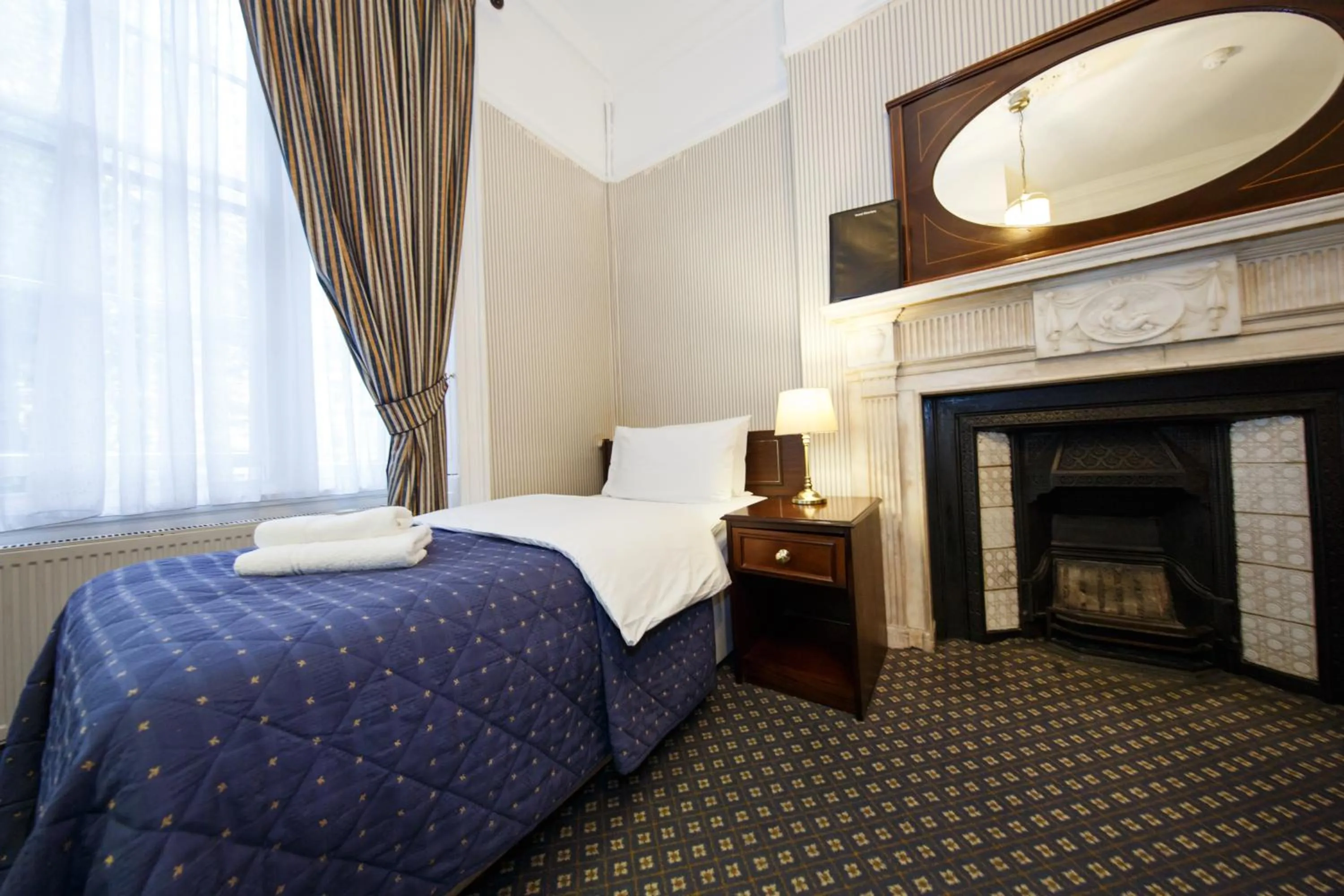 Bed in Regency House Hotel