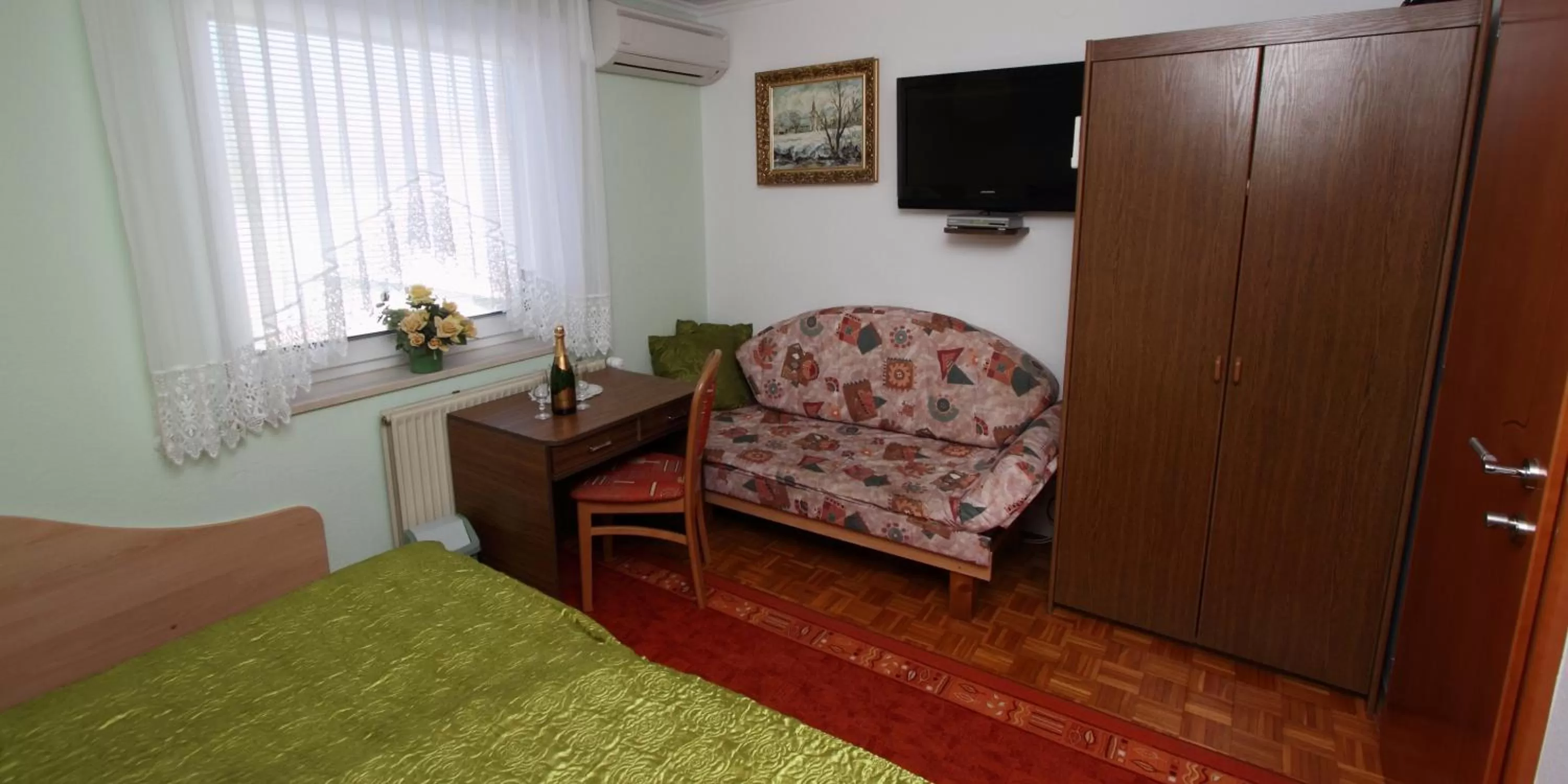 Seating area, Bed in Rooms & Apartments Jana