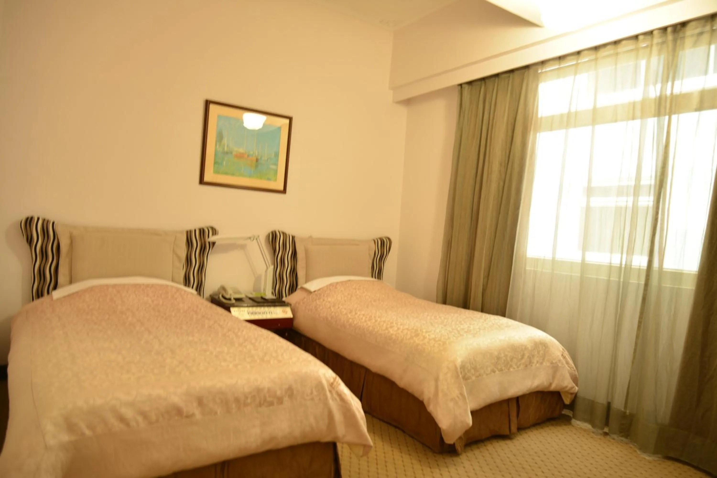 Bed in Kingship Hotel Kaohsiung Inter Continental