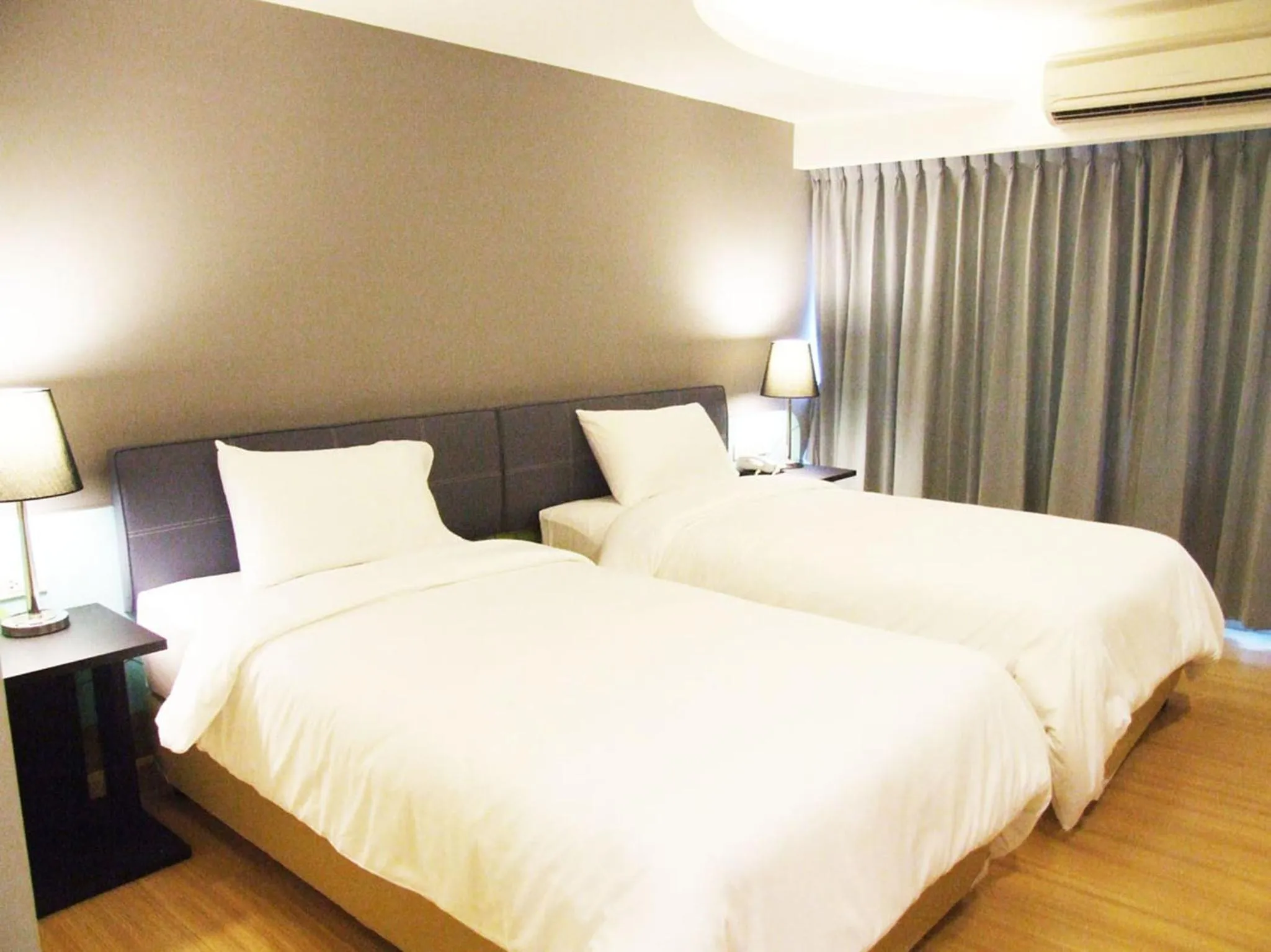 Bed in Grand Tower Inn Sathorn Hotel