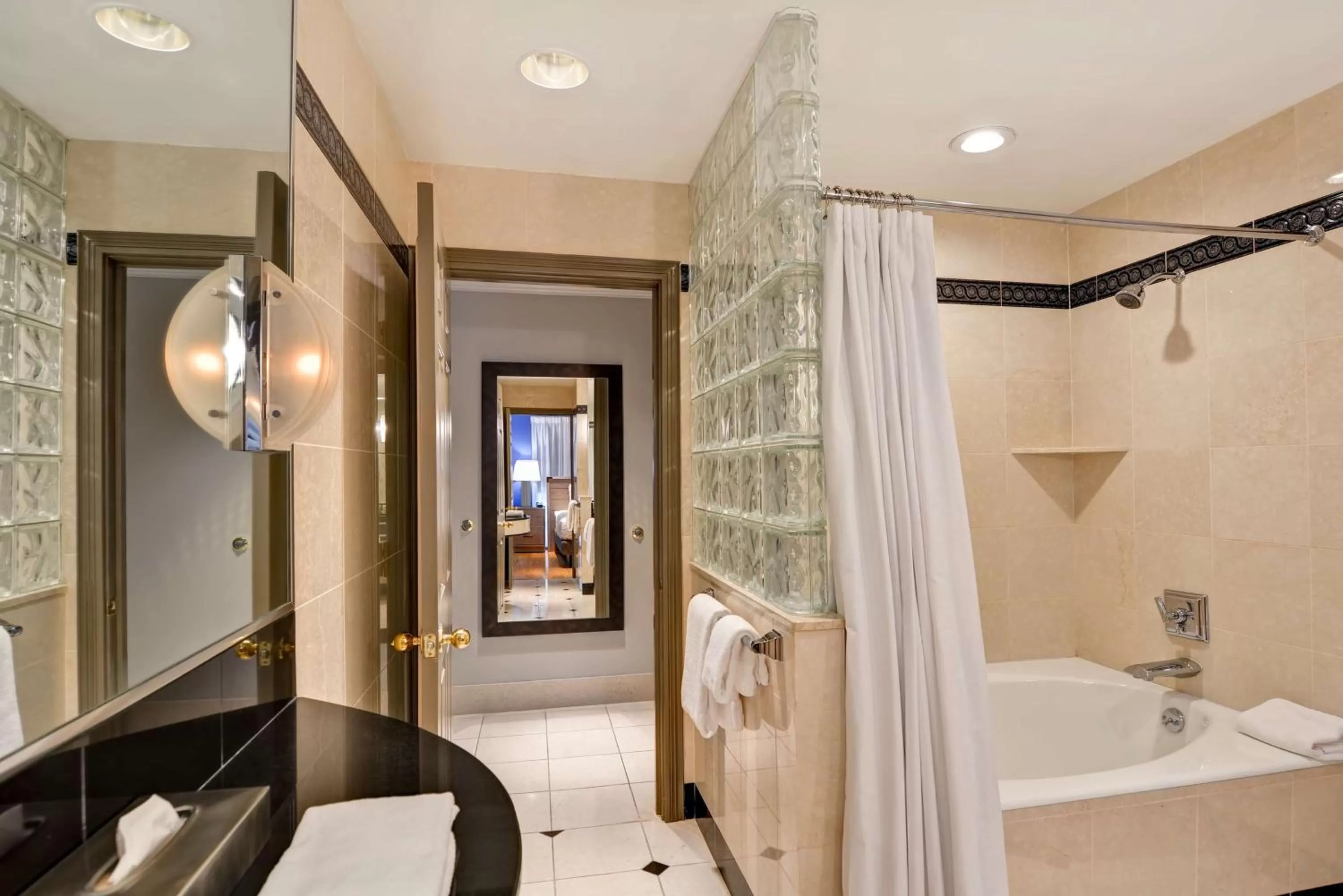 Bathroom, Bed in The Cincinnatian Curio Collection by Hilton