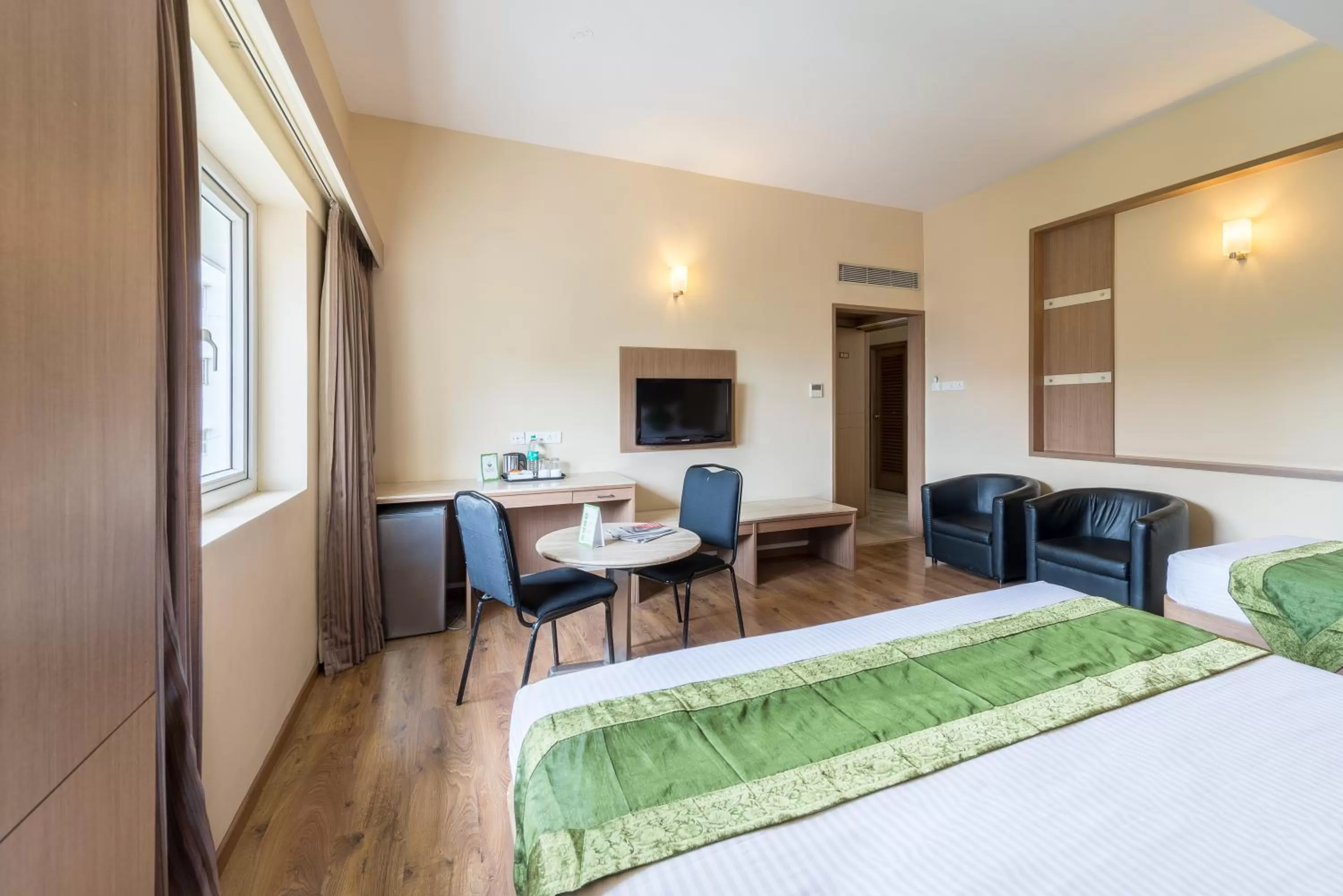 Bed in Treebo ESS Grande