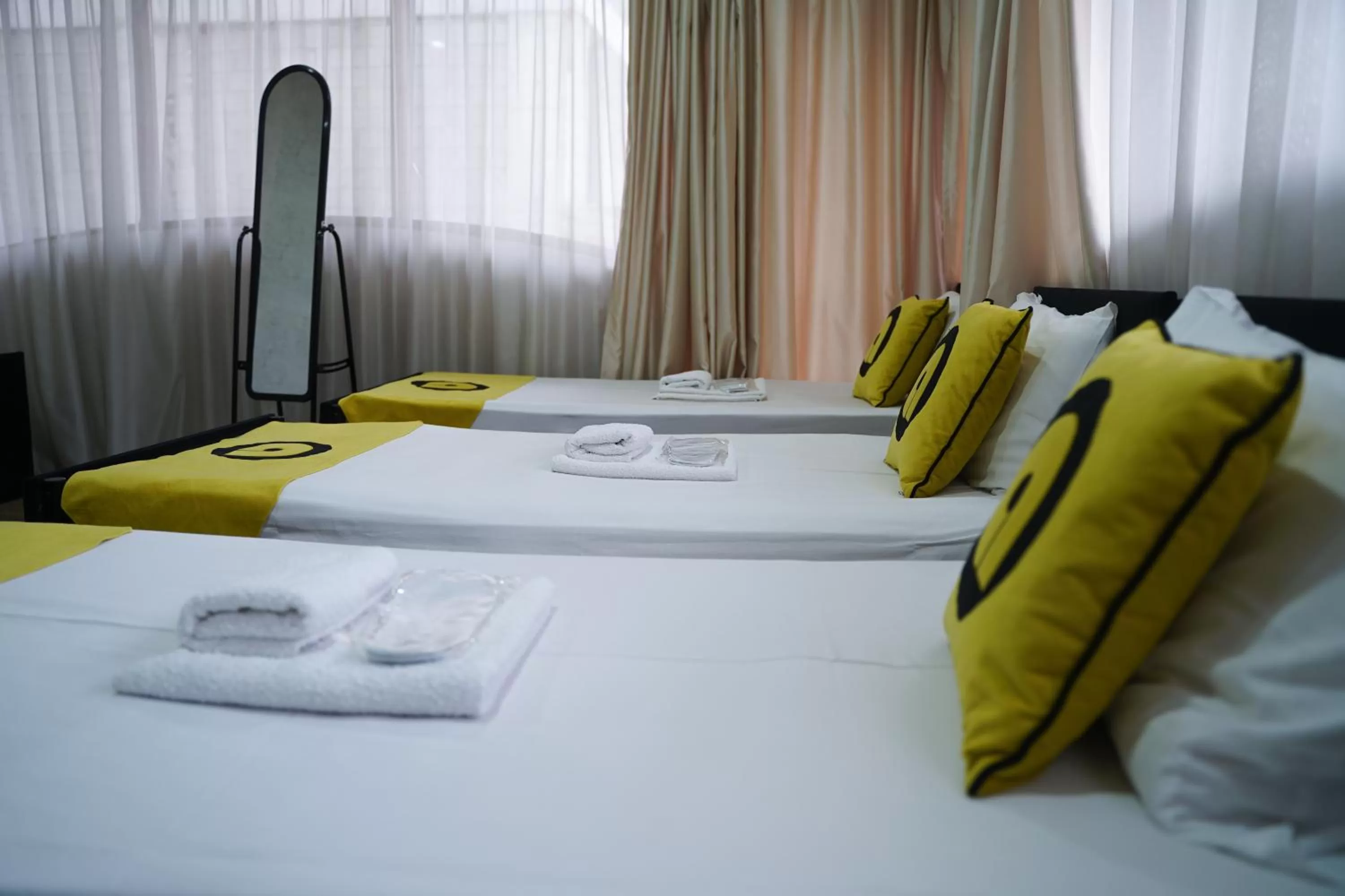 Bed in Aura Plaza Hotel