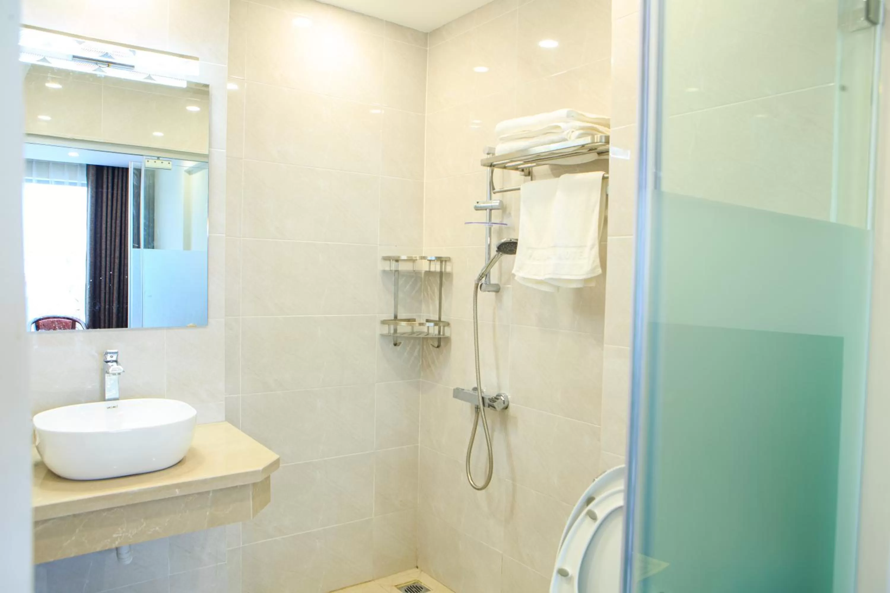 Bathroom in Paloma Hotel & Apartment