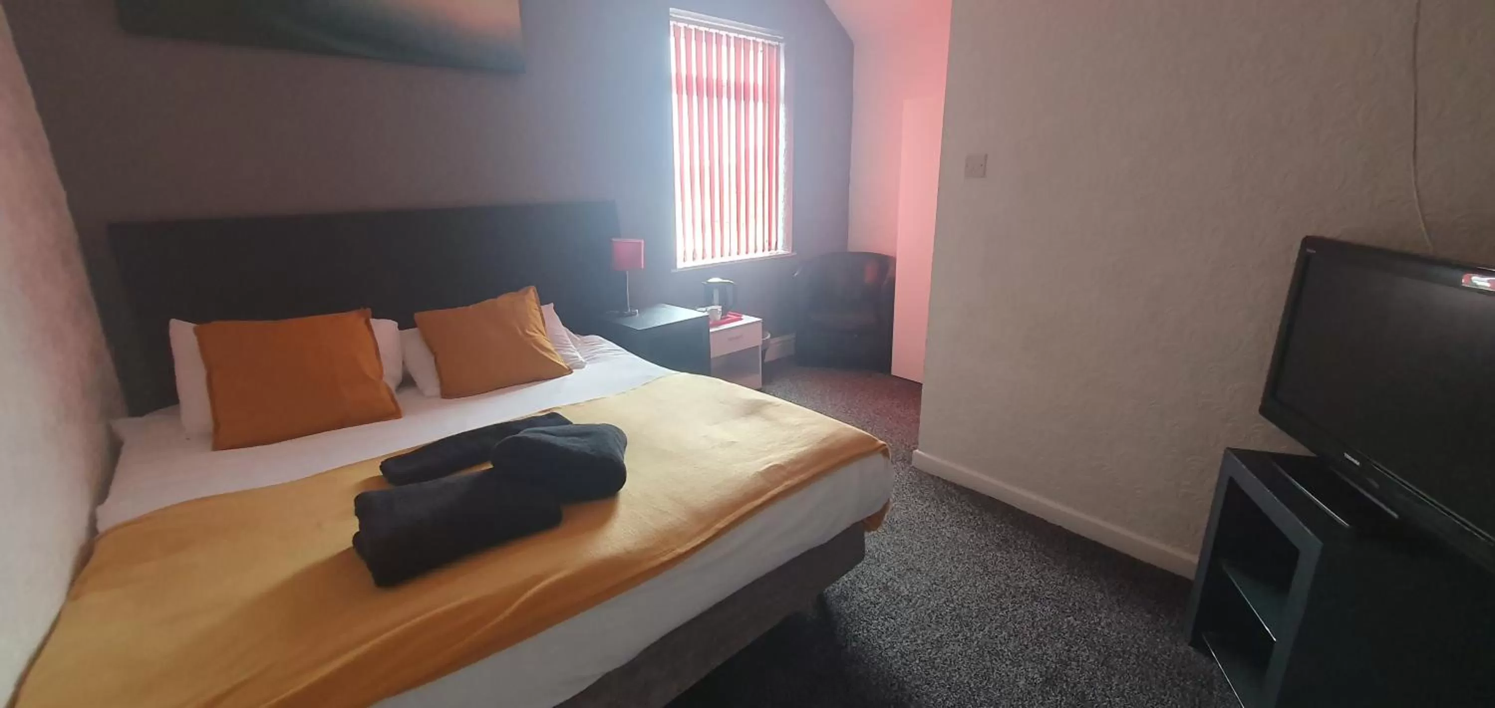 Bed in Palm Beach Hotel by the Sea