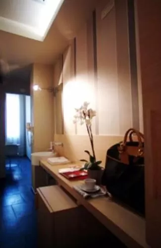 Bedroom in El Homs Palace Hotel