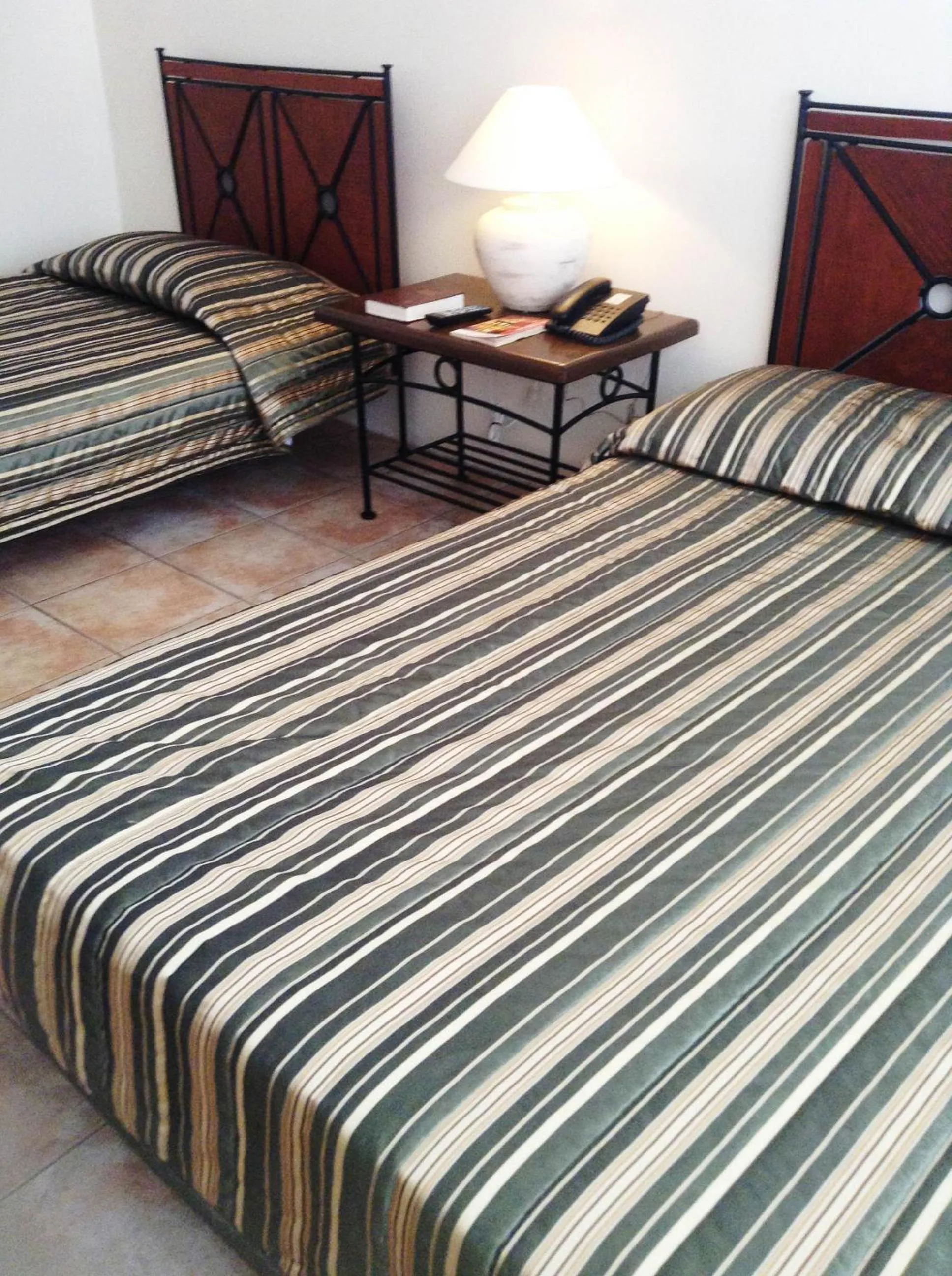 Bed in Citystate Asturias Hotel Palawan