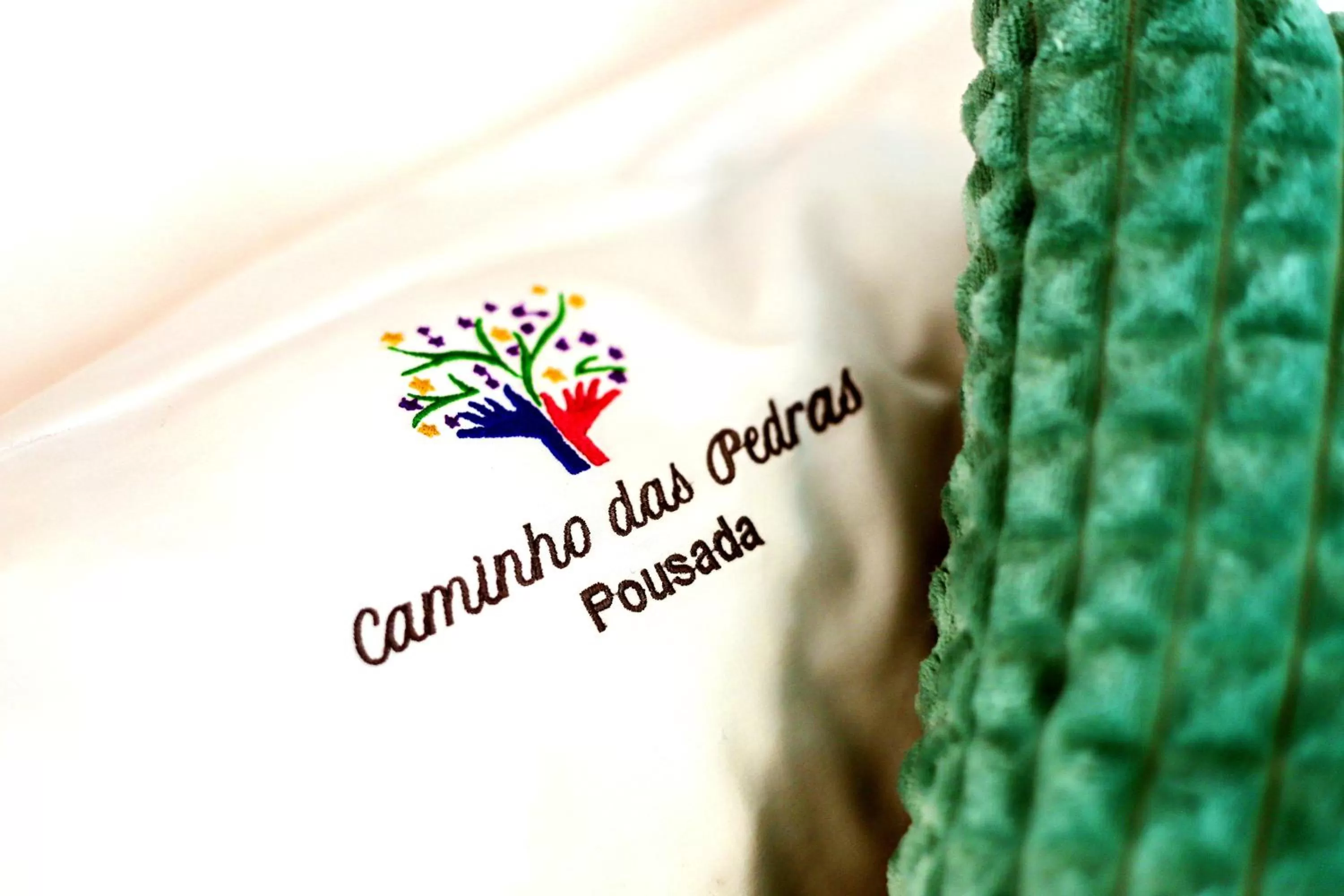 Property logo or sign in Caminho das Pedras Pousada de Charme