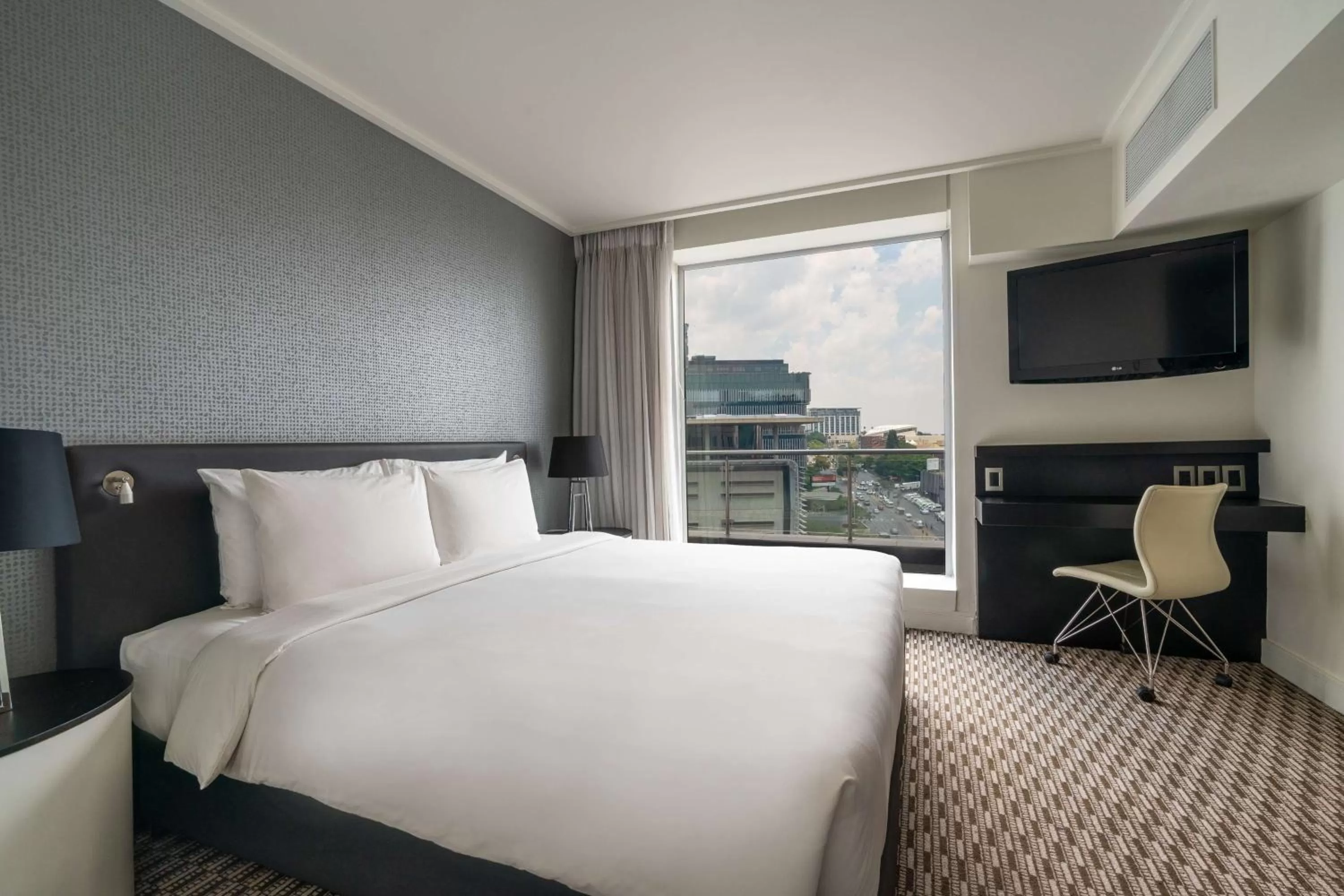 Photo of the whole room, Bed in Radisson Blu Gautrain Hotel, Sandton Johannesburg