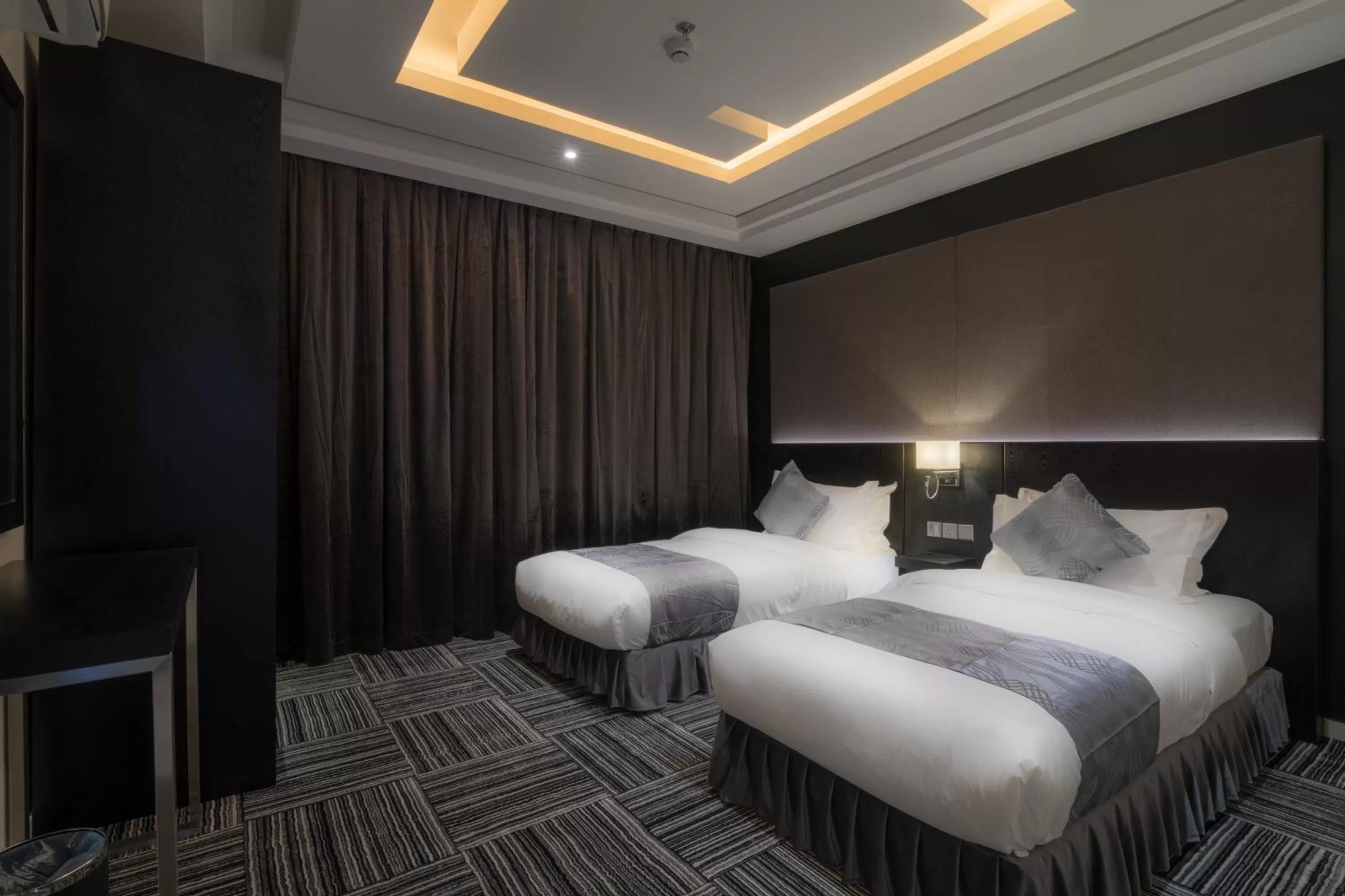 Bed in South Hotel Suites