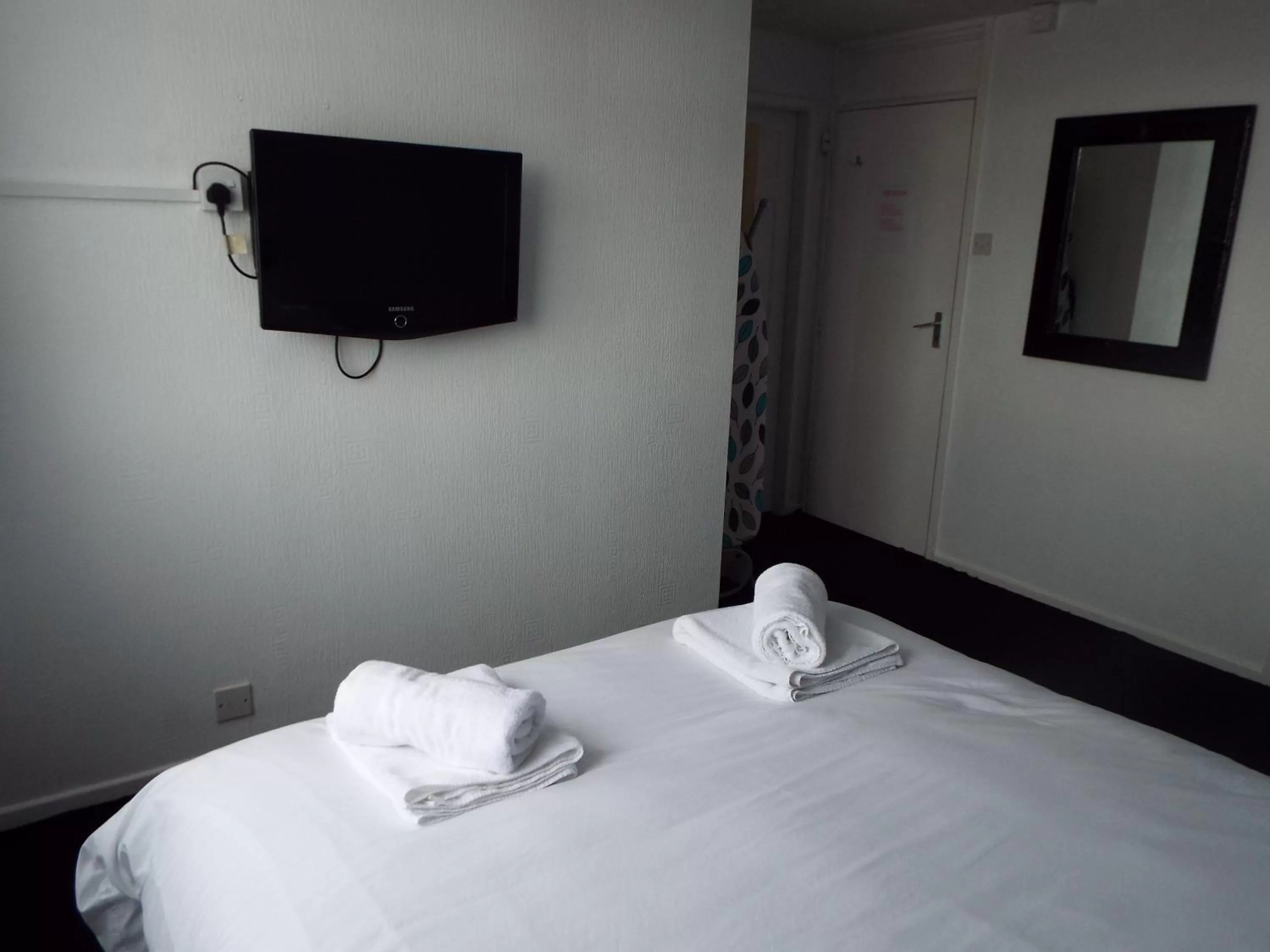 TV/Entertainment Center in Alfies Hotel