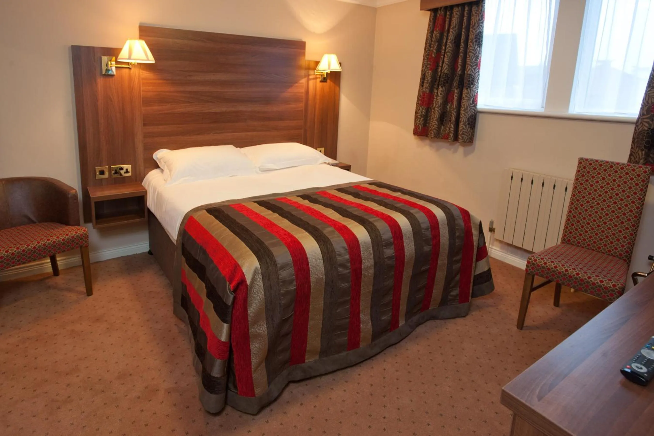 Bed in Adair Arms Hotel