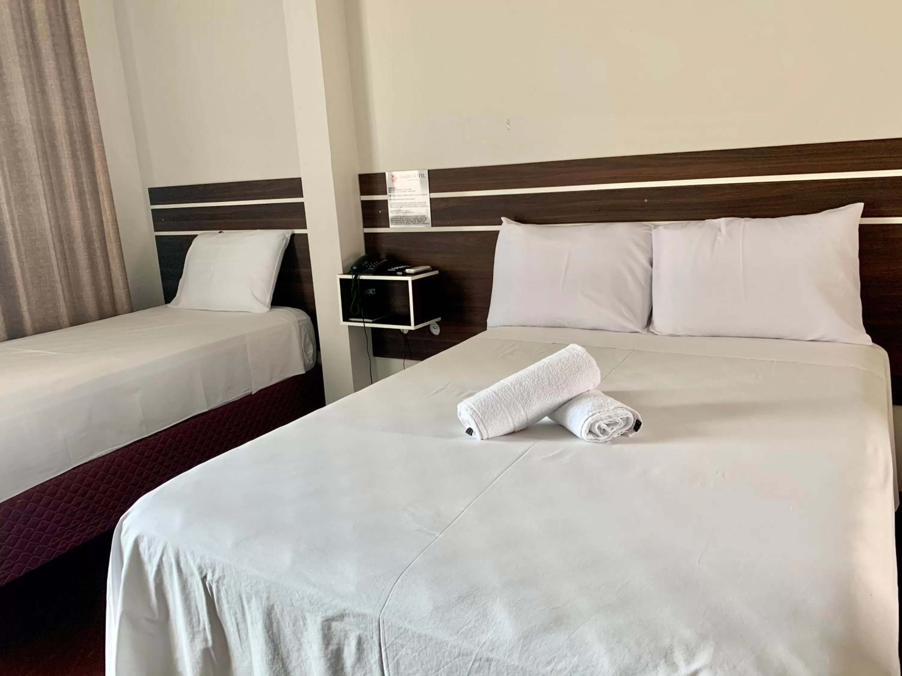 Bed in SAMIR HOTEL COMFORT