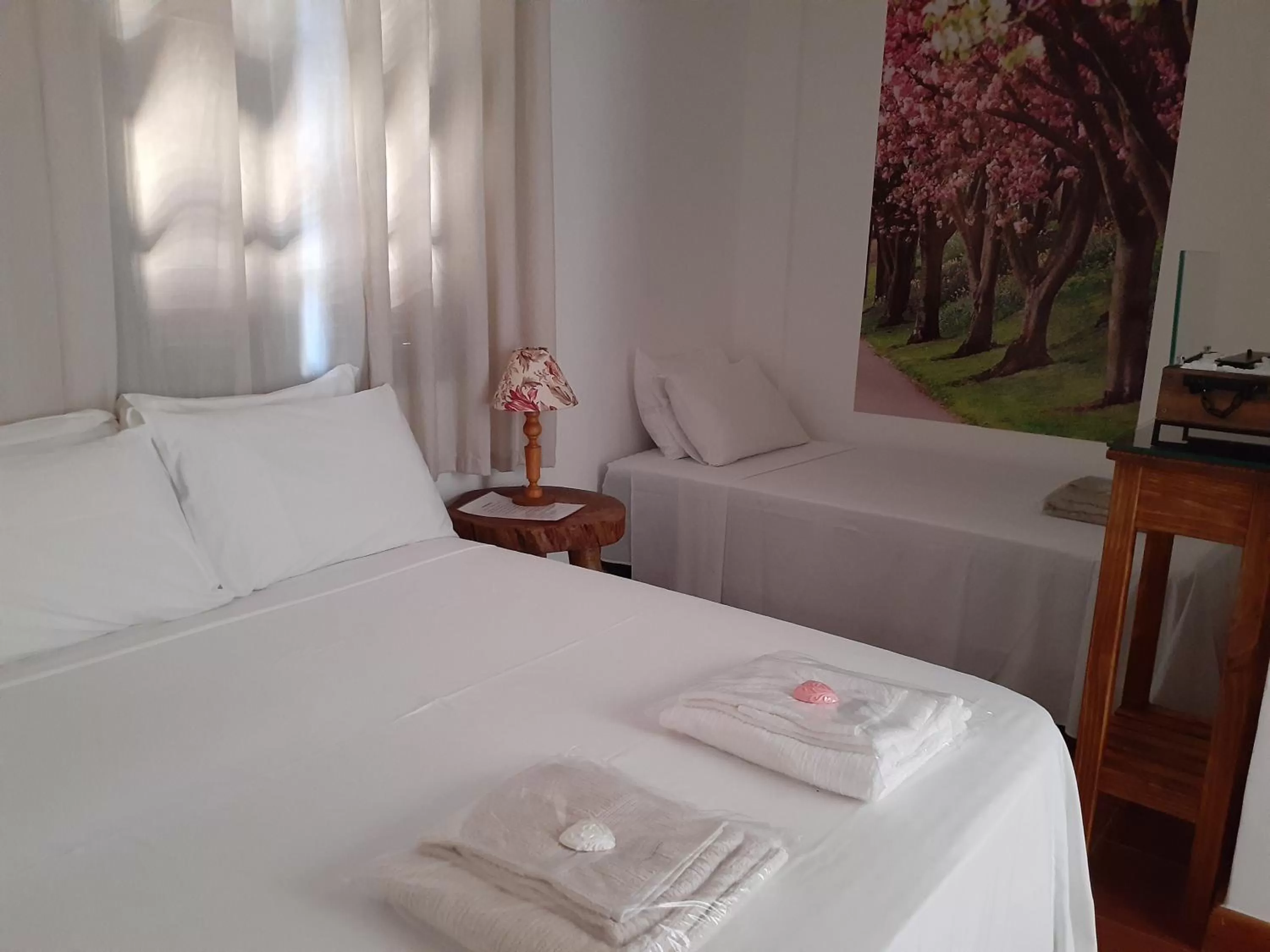 Bed in Pousada R.N.C. Nosso Paraíso