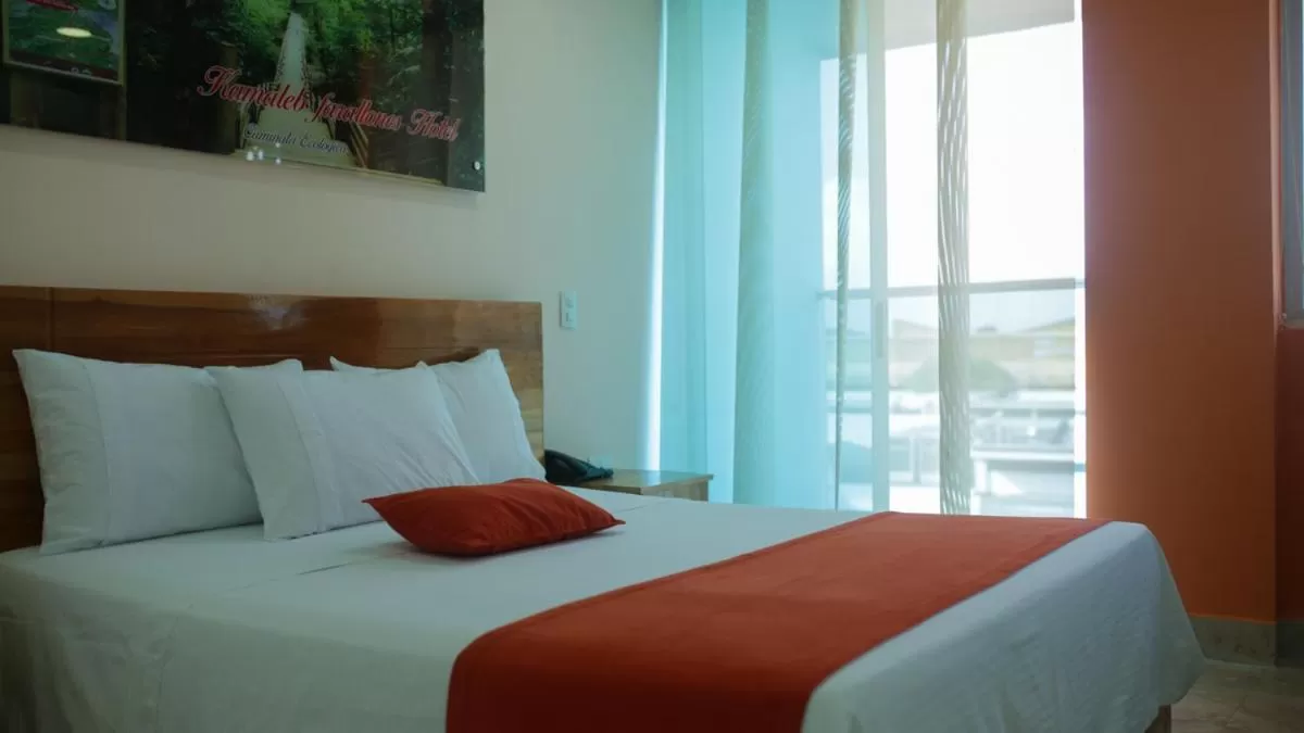 Bed in Kamaleb Farallones Hotel