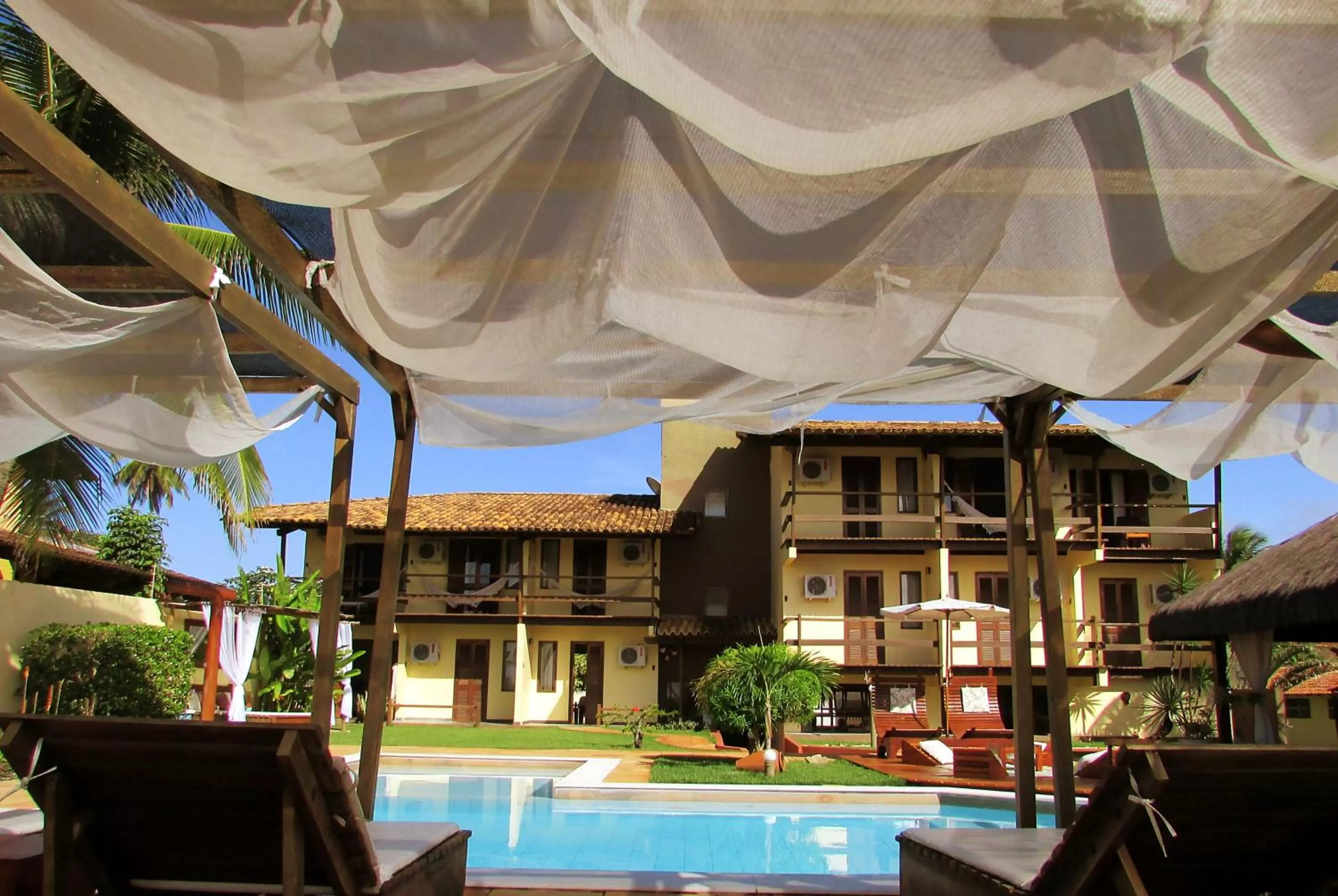 Garden, Swimming Pool in Pousada dos Hibiscus