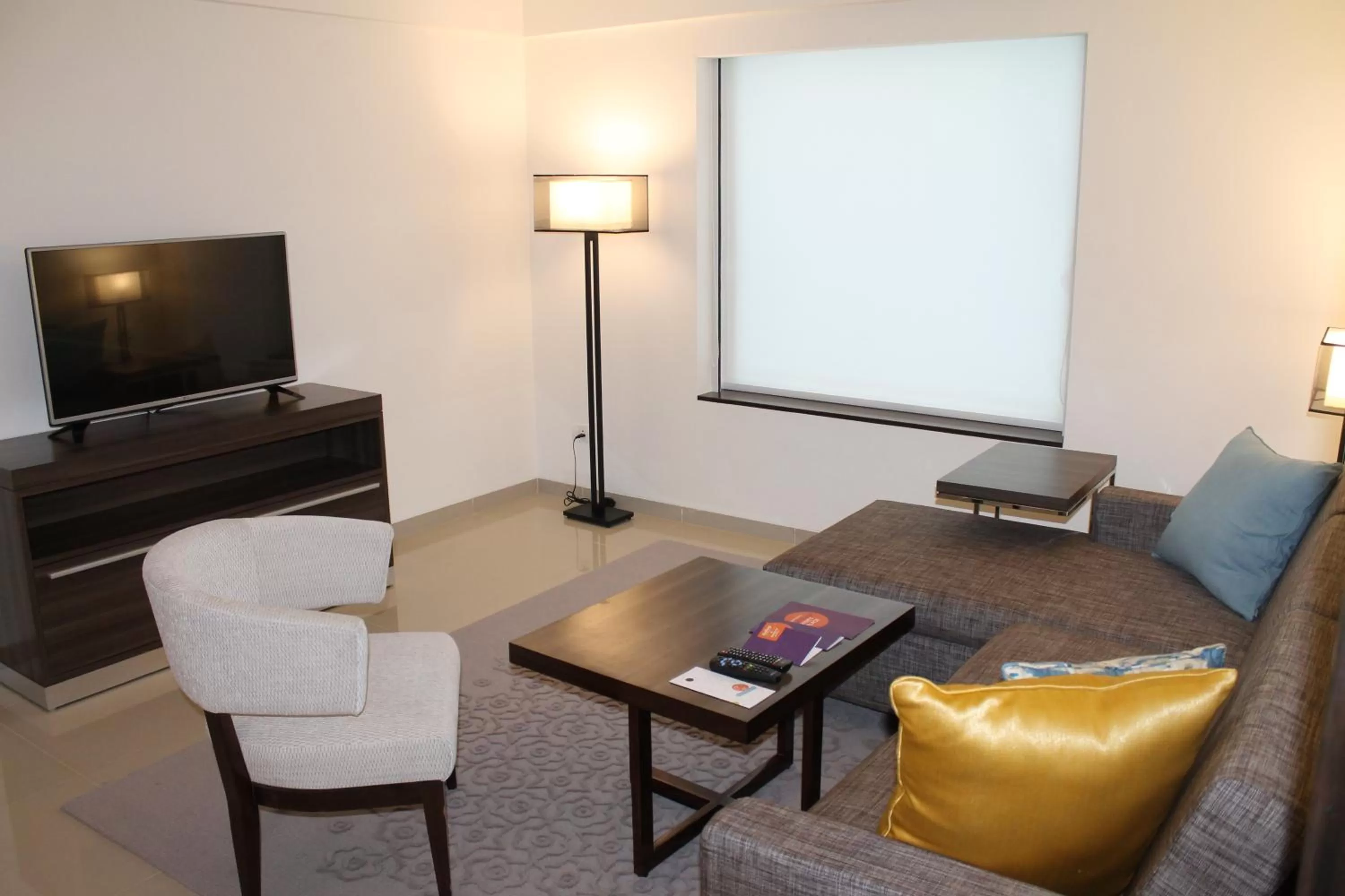 Communal lounge/ TV room in The Residency Towers, Rameswaram