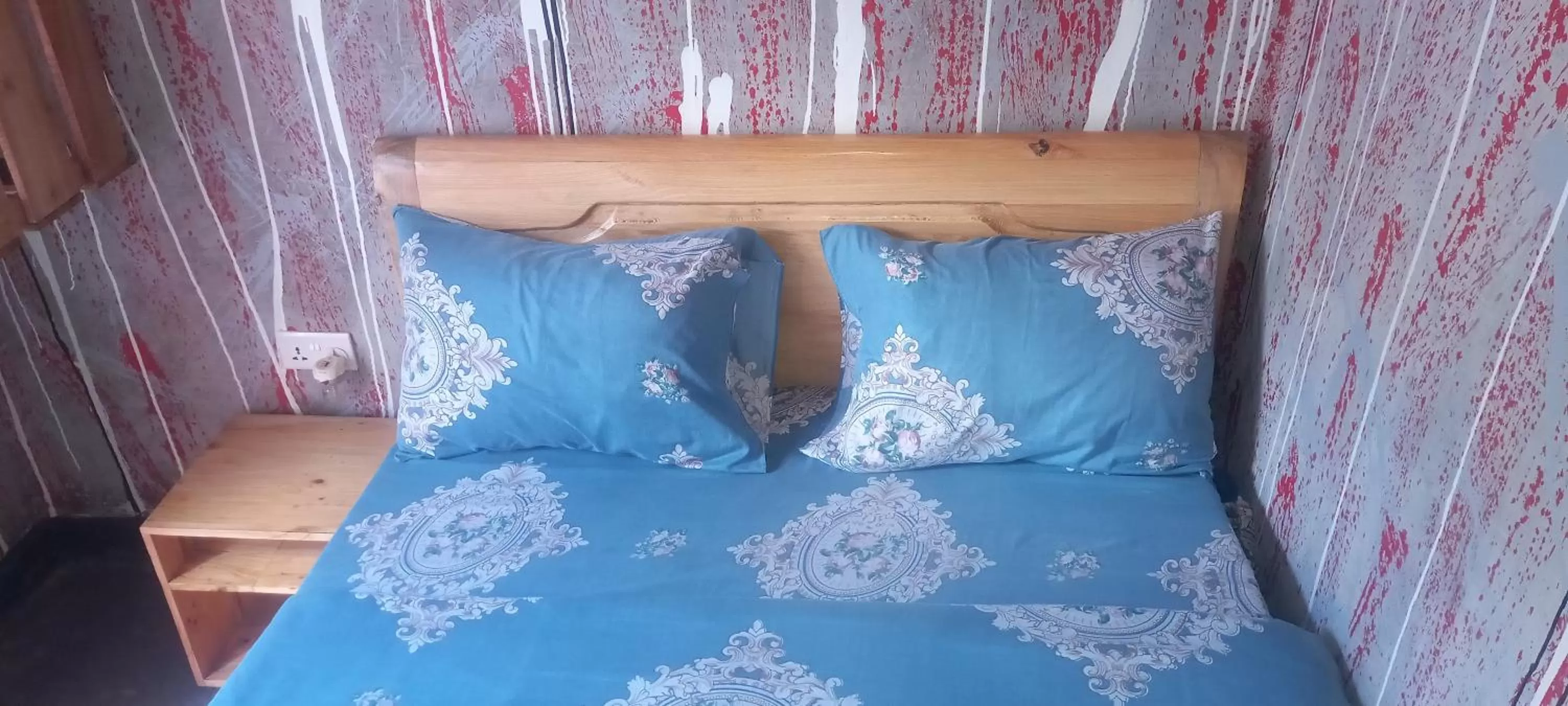 Bed in Tommy's Budget Rooms