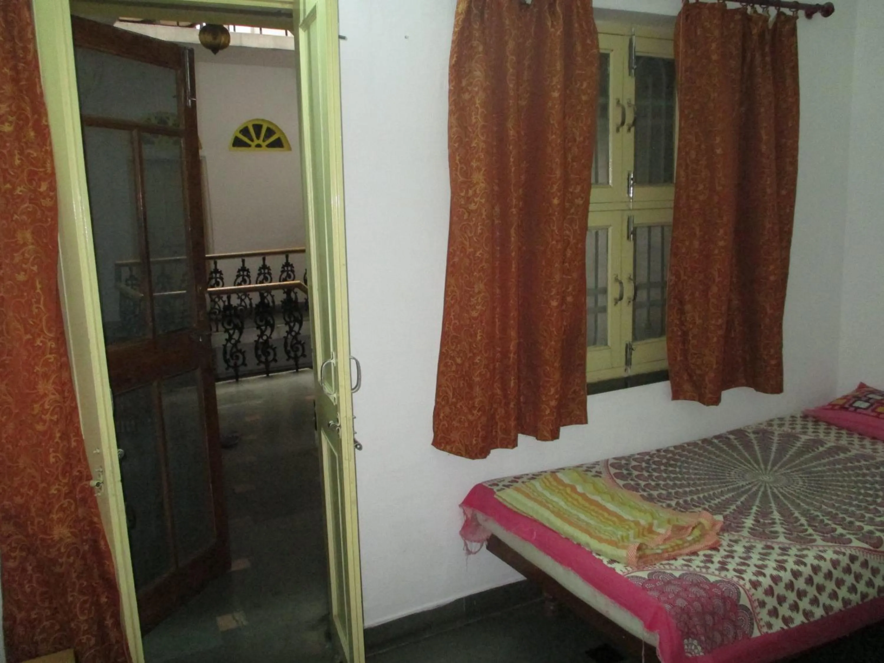 Bed in Udai Haveli Guest House