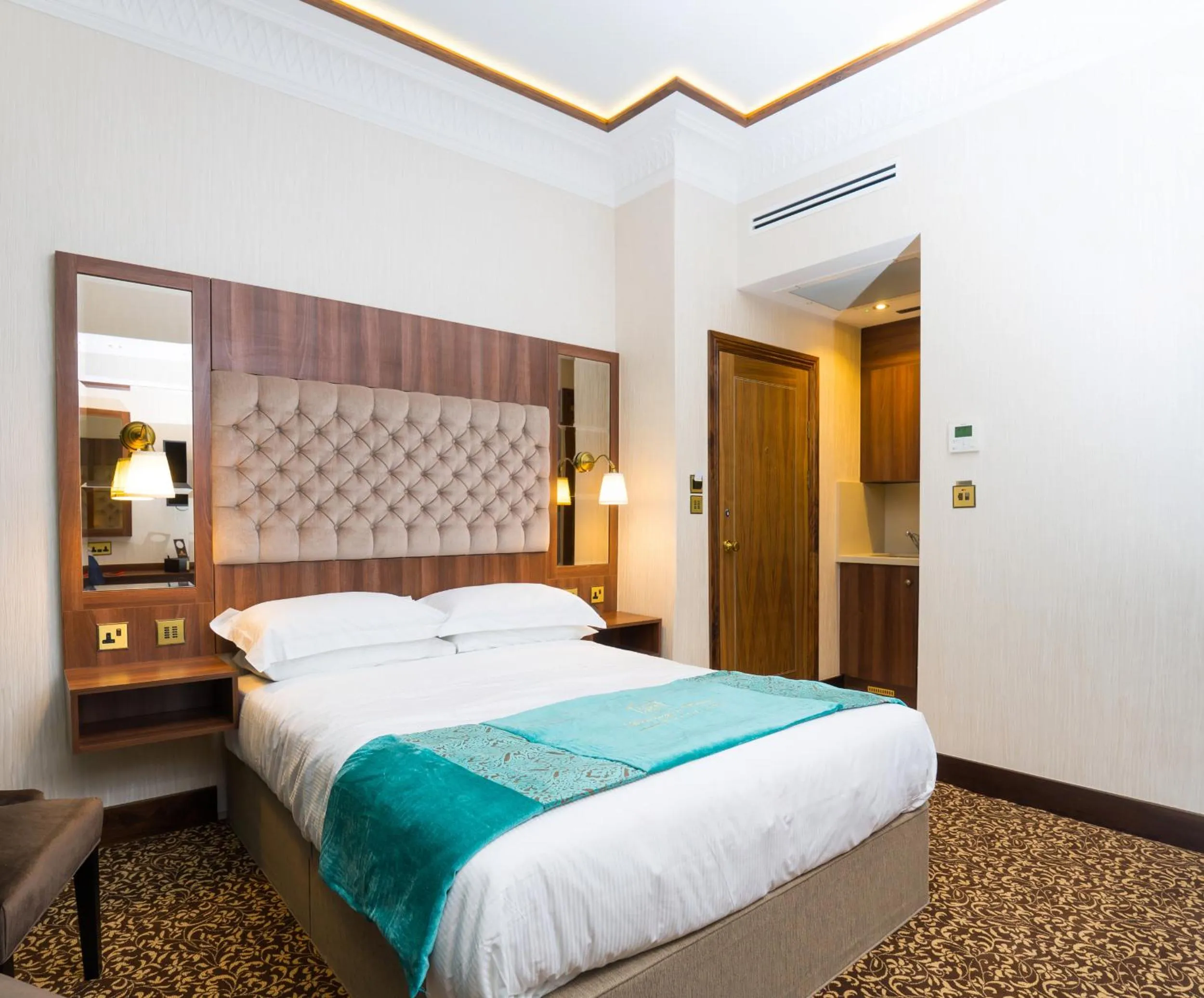 Bed in Kensington Prime Hotel