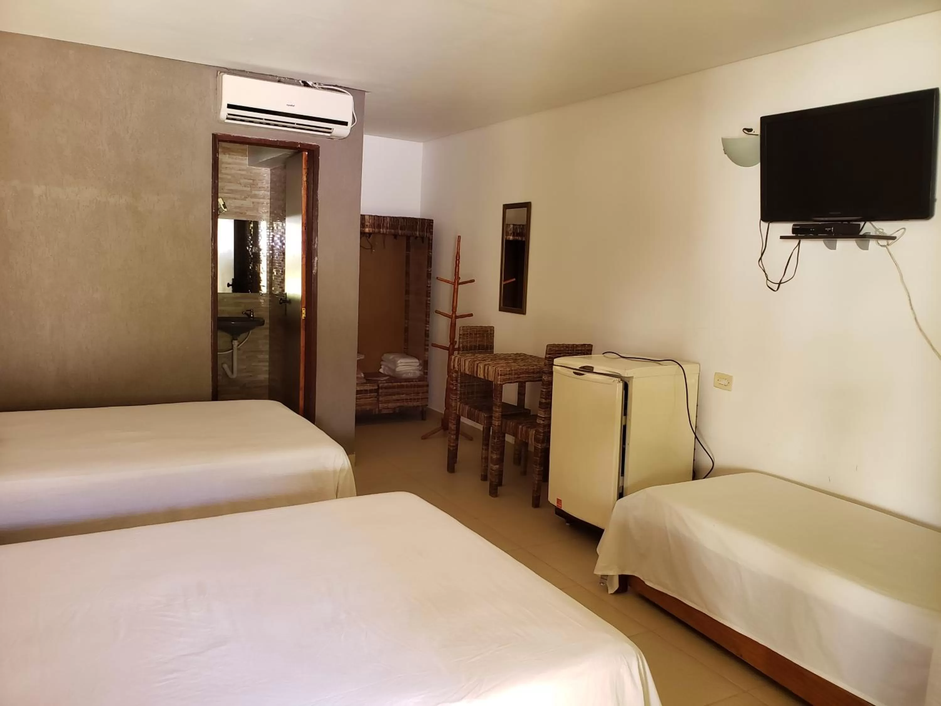 Bed in Pousada Costa Tropical