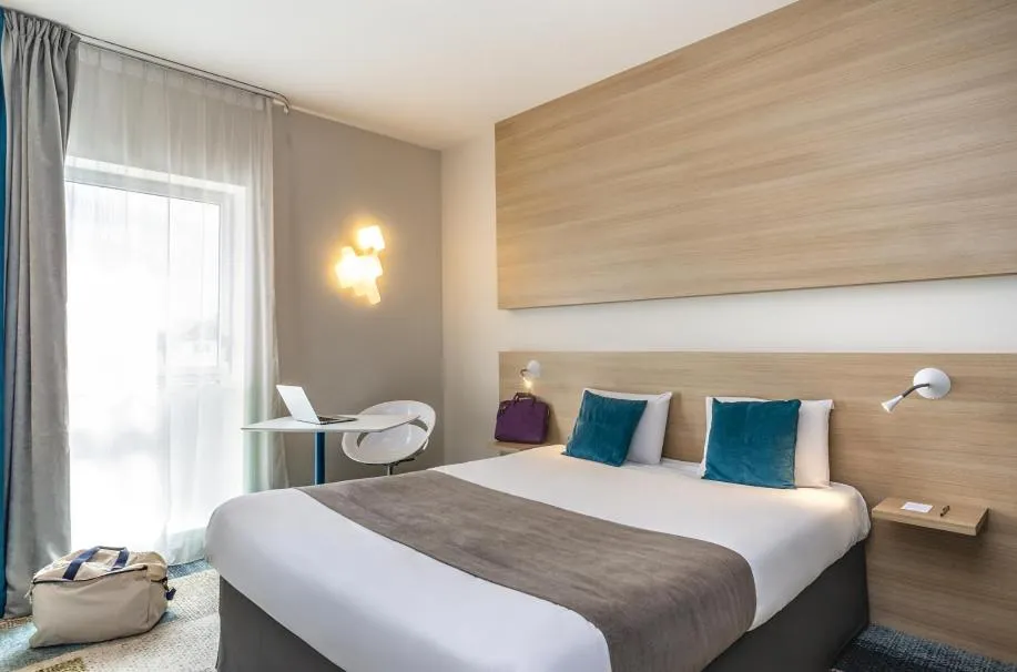 Bed in Kyriad Le Mans Est