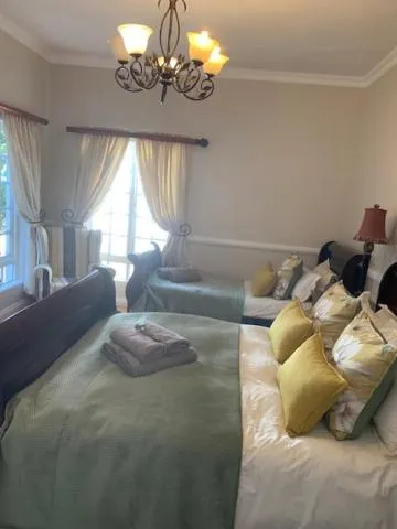 Bed in A Tapestry Garden Guest House