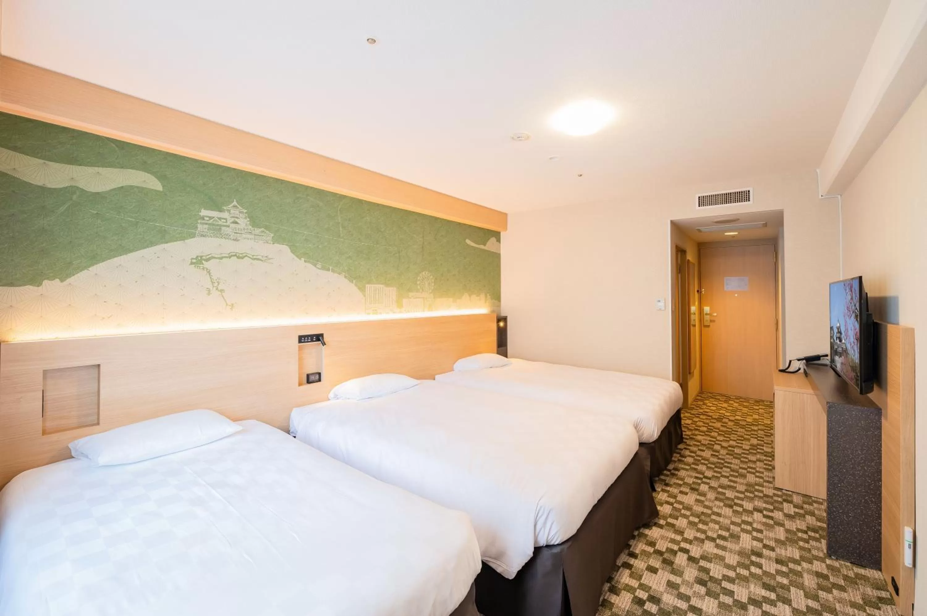 Bed in Matsuyama Tokyu REI Hotel