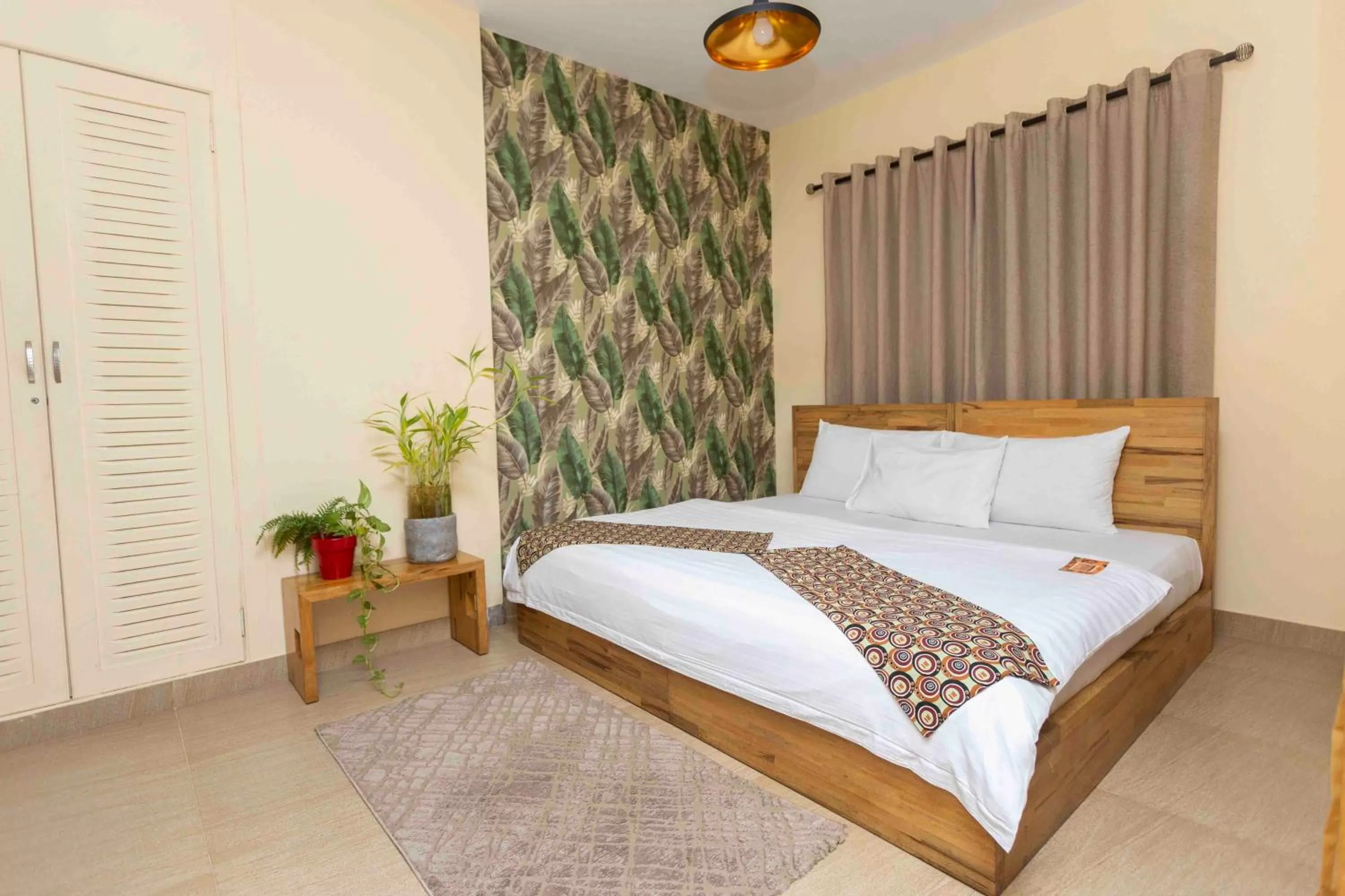 Bed in Roots Hotel Apartment