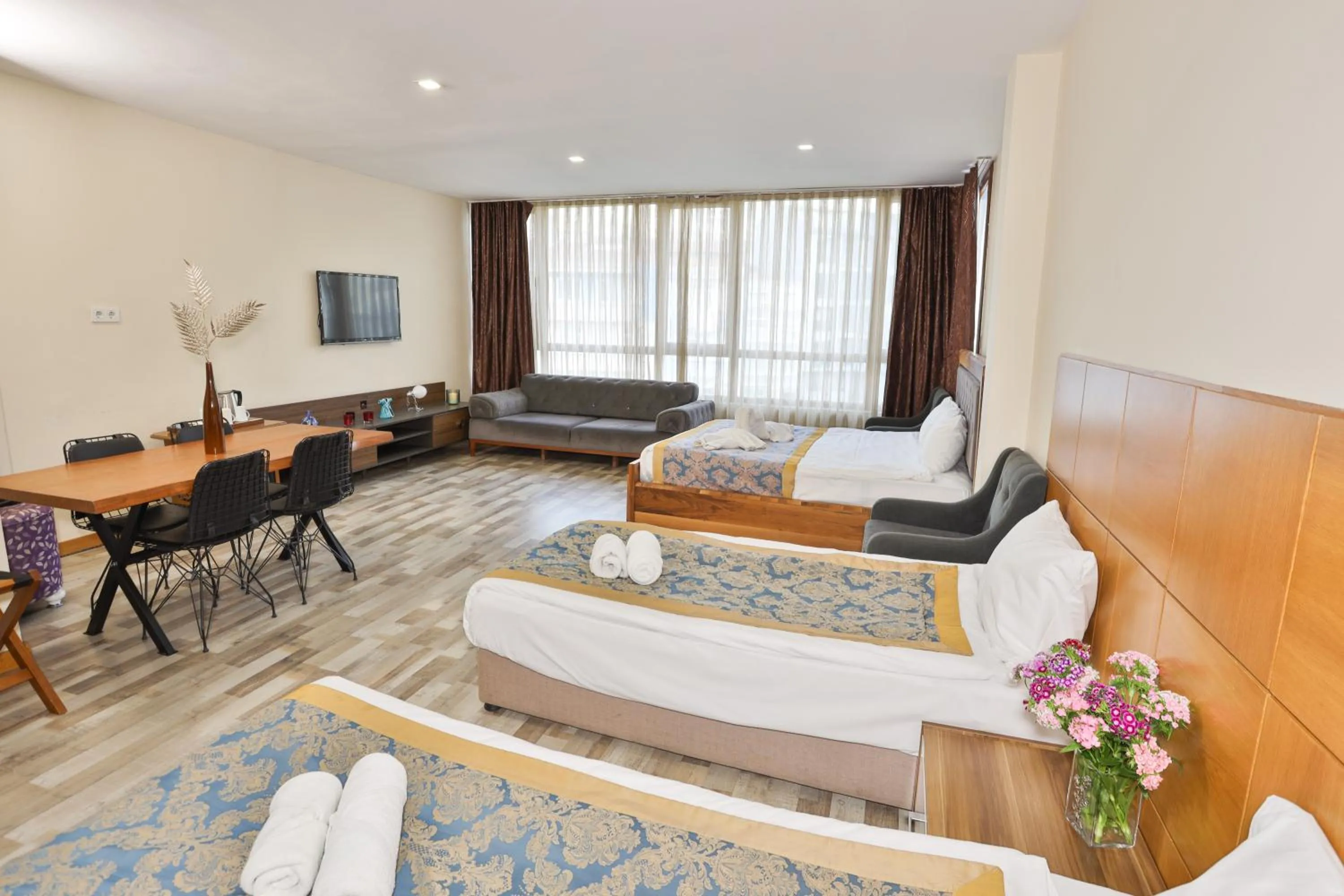 Seating area, Bed in Cumbali Plaza Hotel