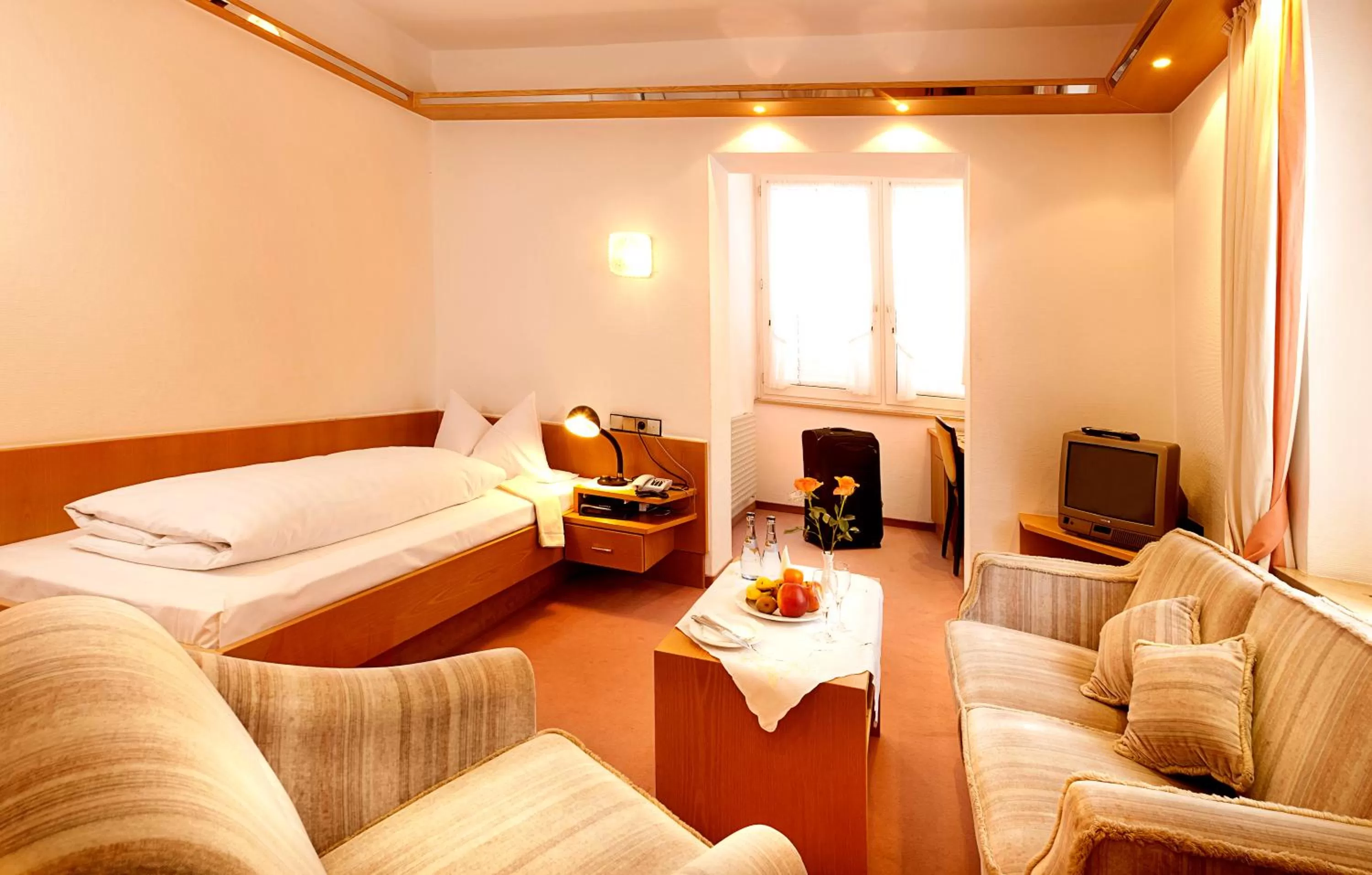 Living room, Bed in Hotel Luitpold