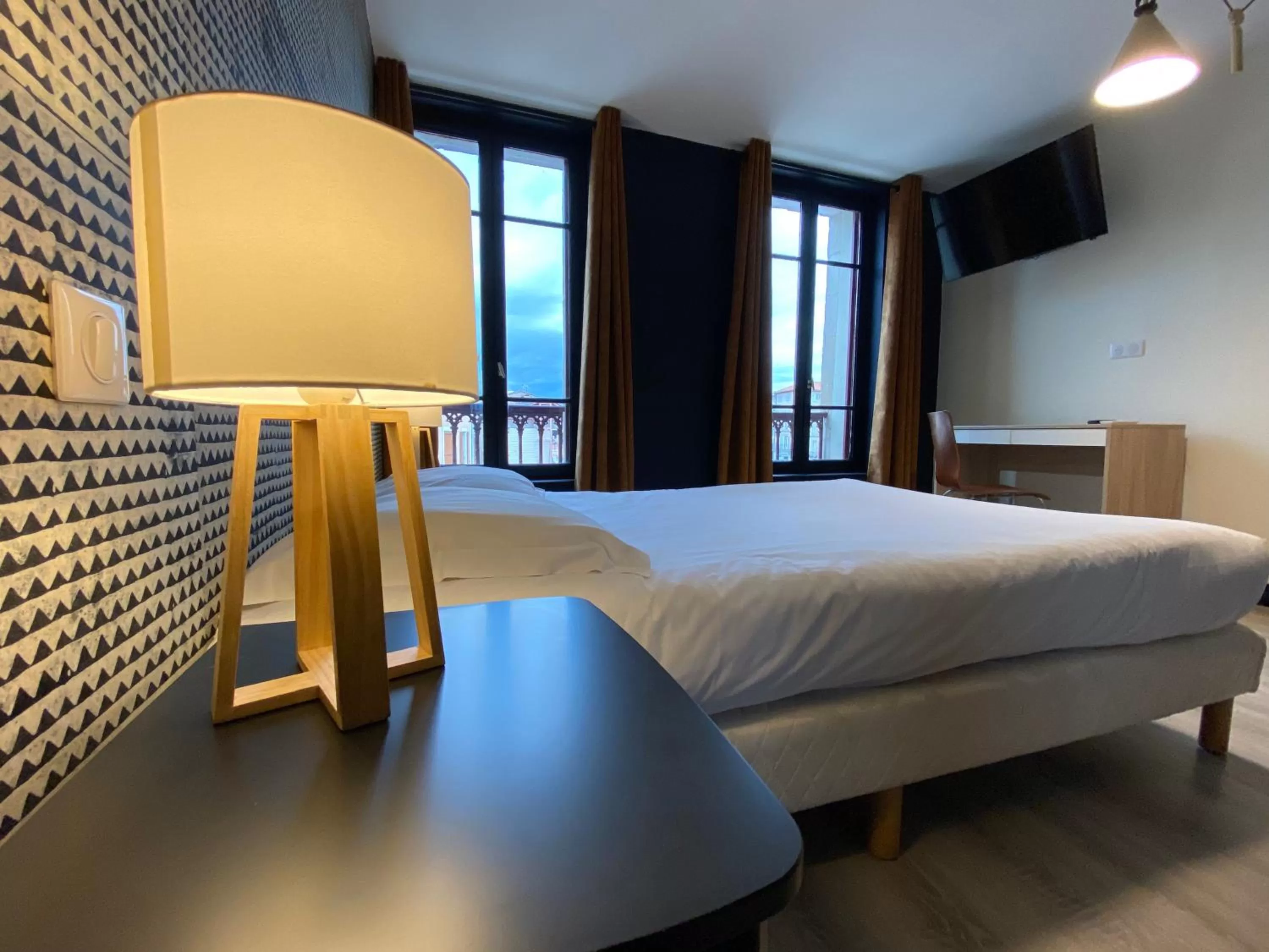 Bedroom in Le Miredames Hôtel-Bar