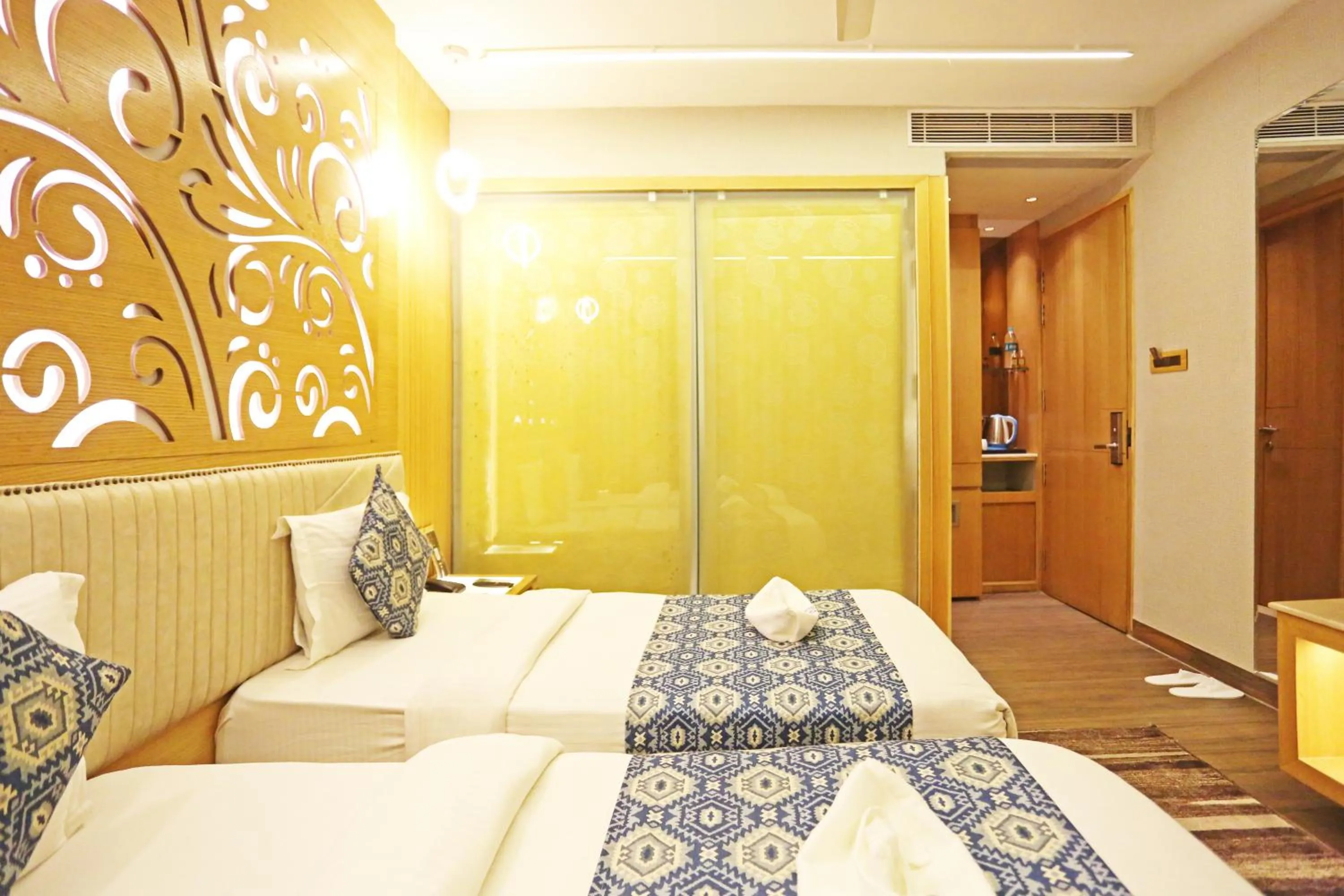 Bed in JRD Luxury-Business Hotel