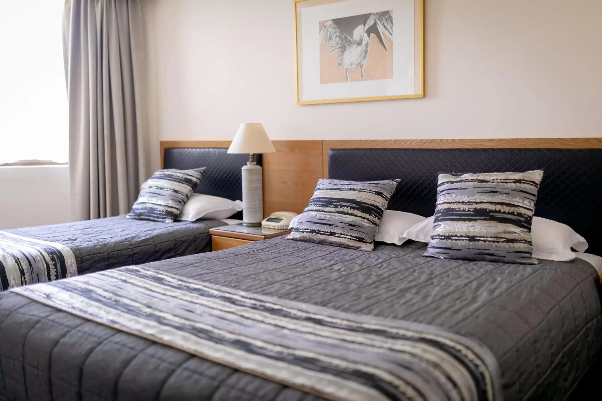 Bed in Charbonnier Motor Inn