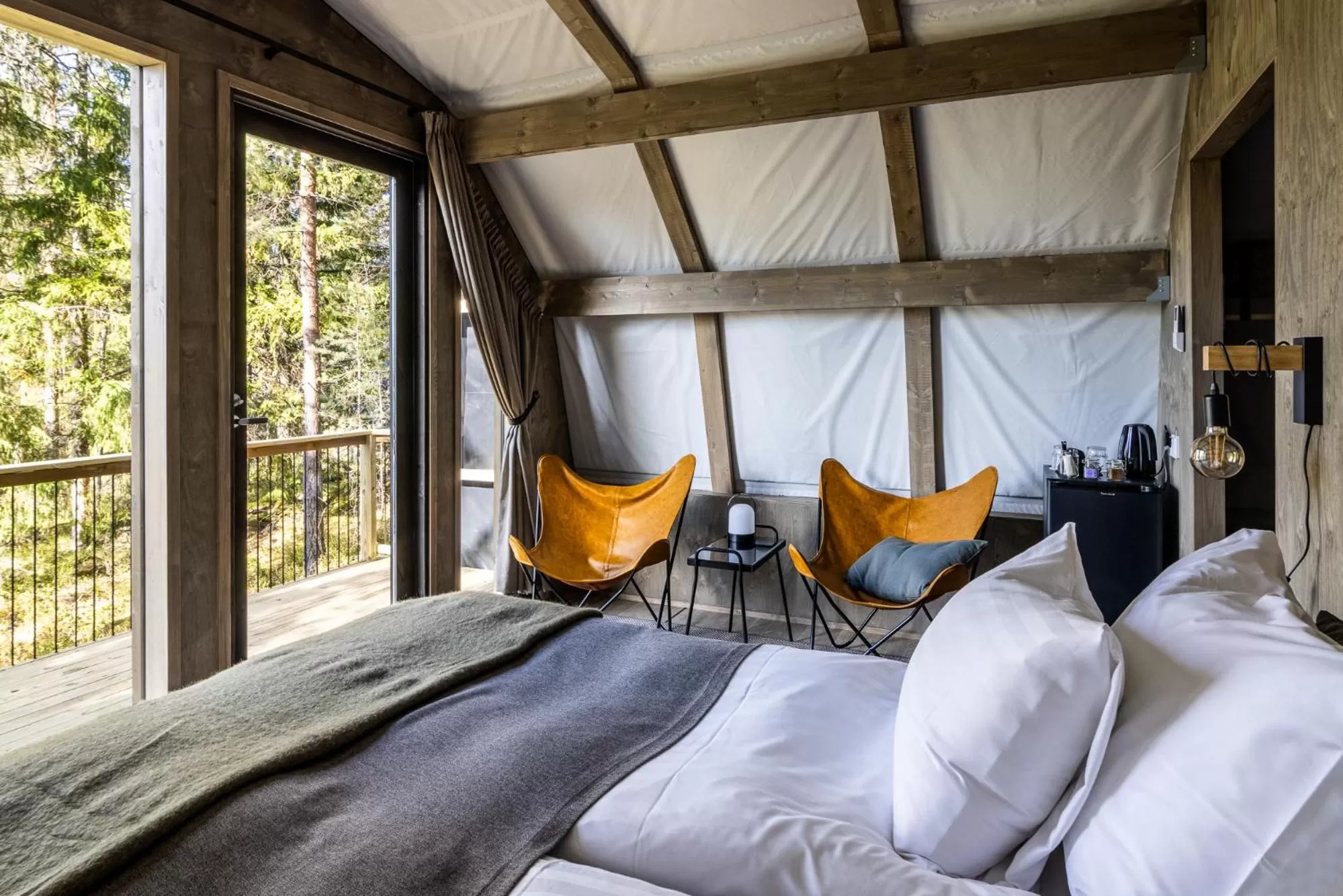 Bed in Haltia Lake Lodge nature boutique hotel & glamping