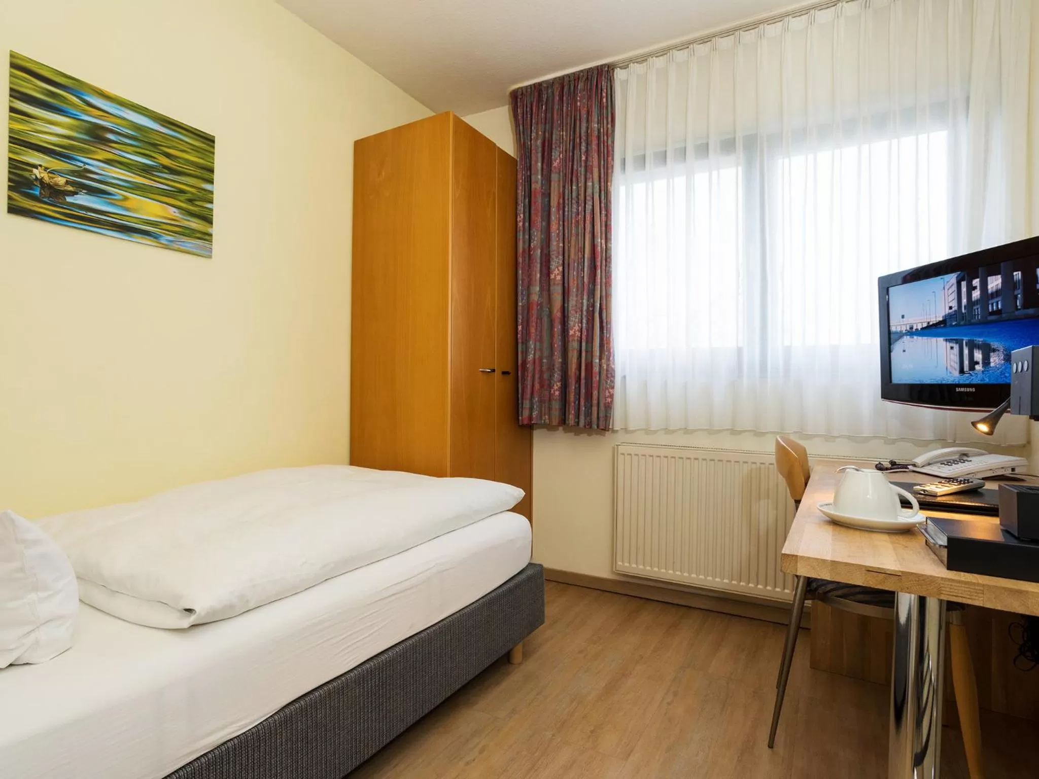 Photo of the whole room, Bed in Hotel & Wirtshaus Hansen