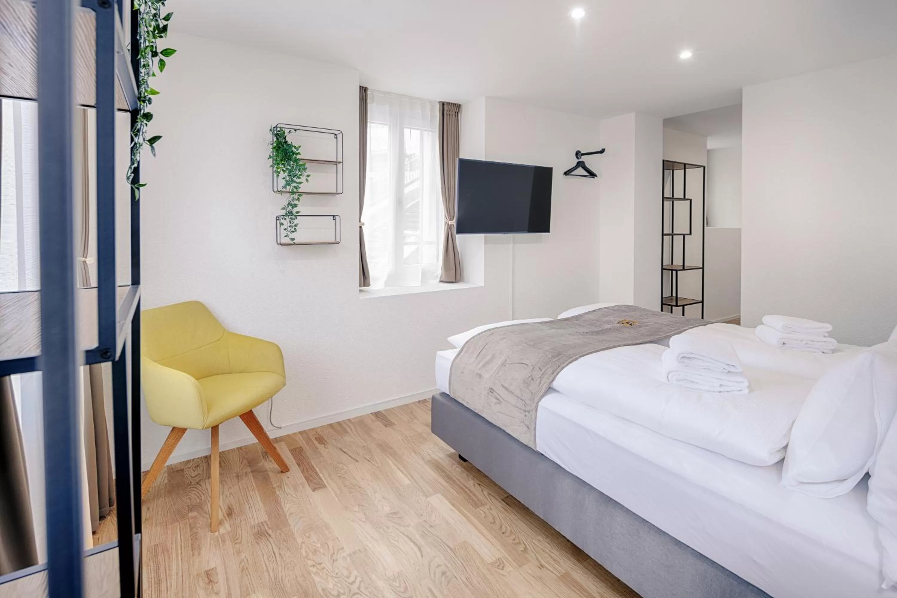 Bed in VISIMO Apartments St Georgen-Strasse St Gallen - Design City Nature