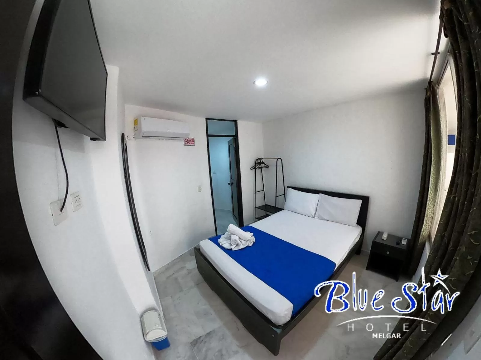 Bed in Blue Star Hotel