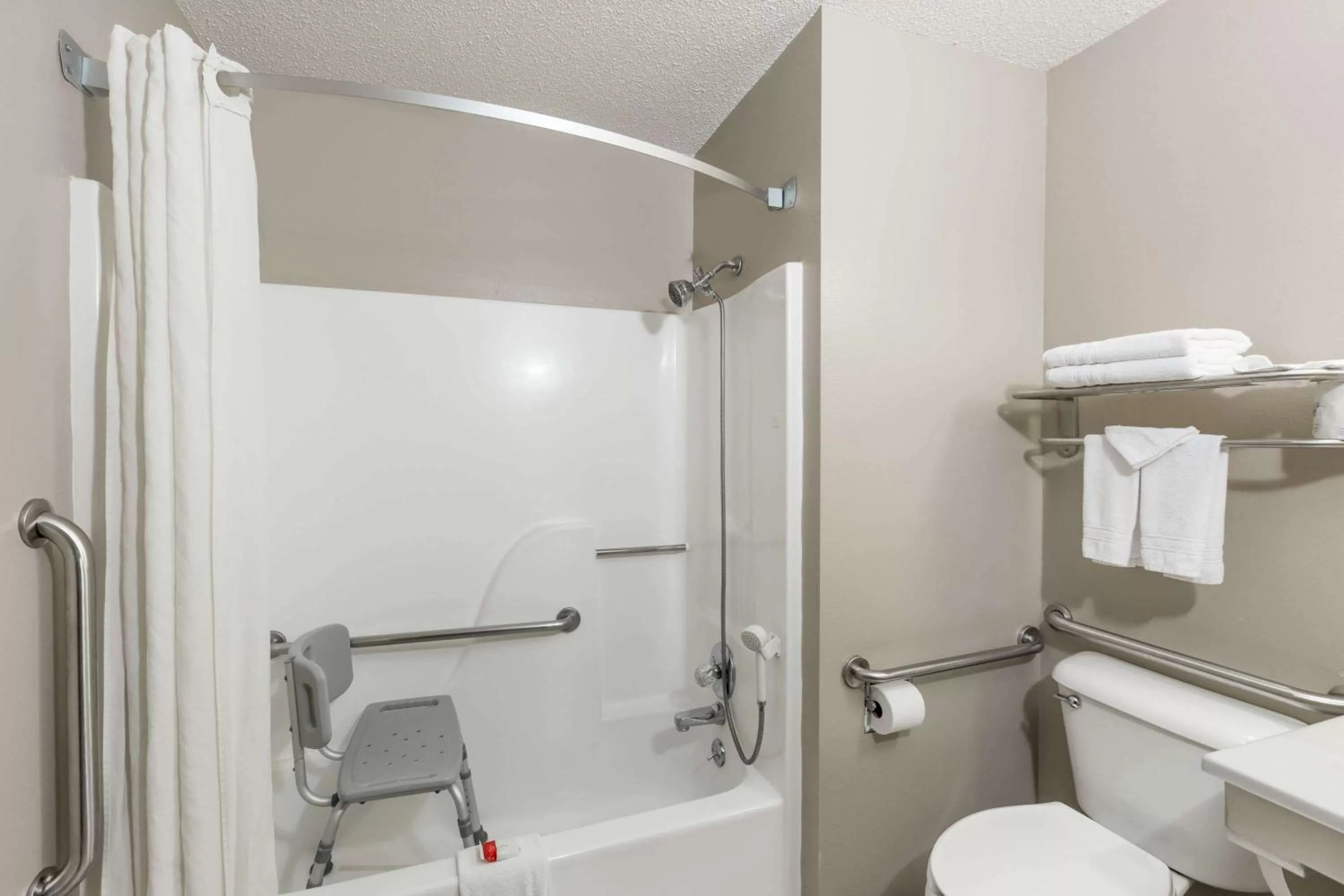 Bathroom in Super 8 by Wyndham Hays KS